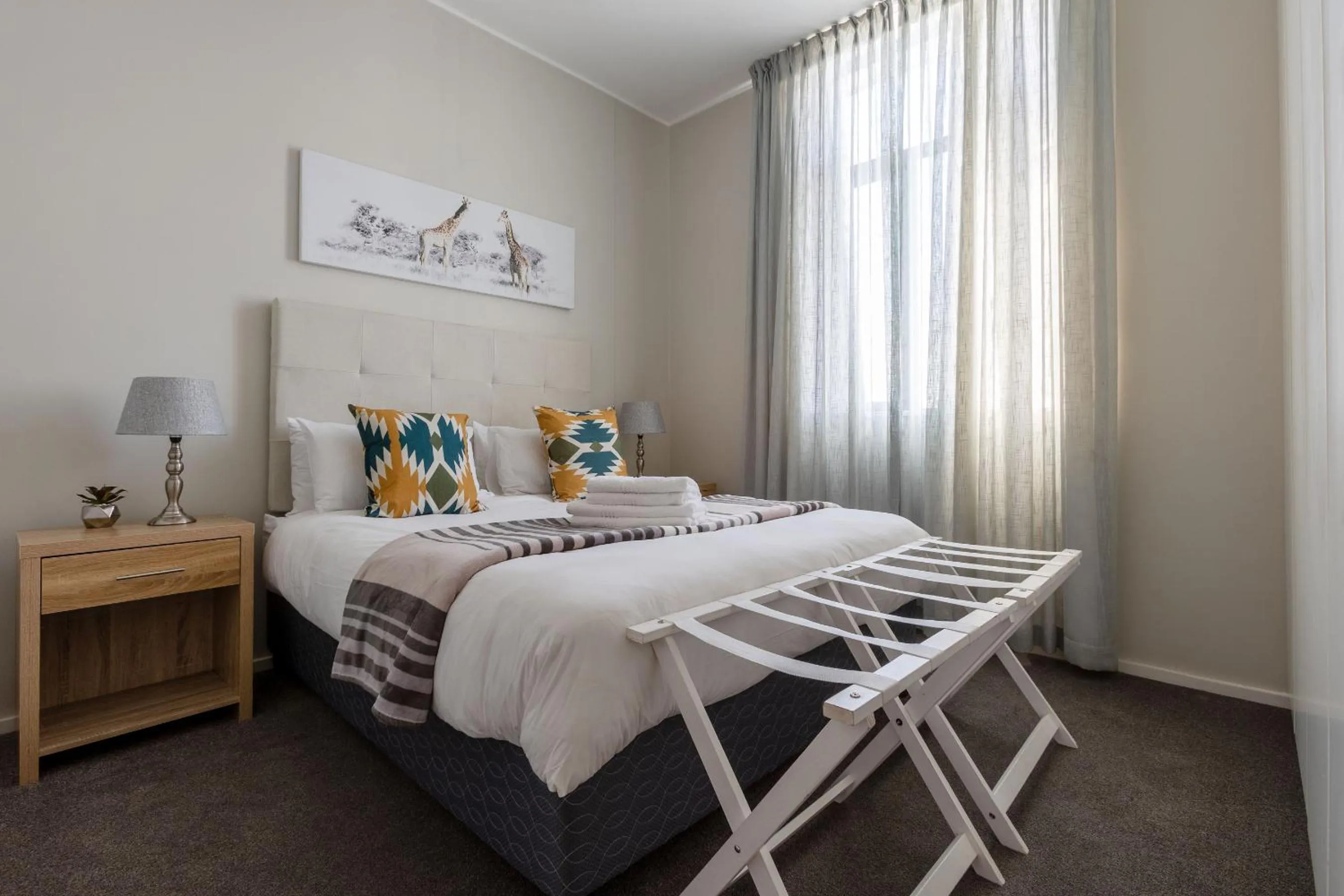 Bed in Axis Luxury Apartments by Century City Hotels