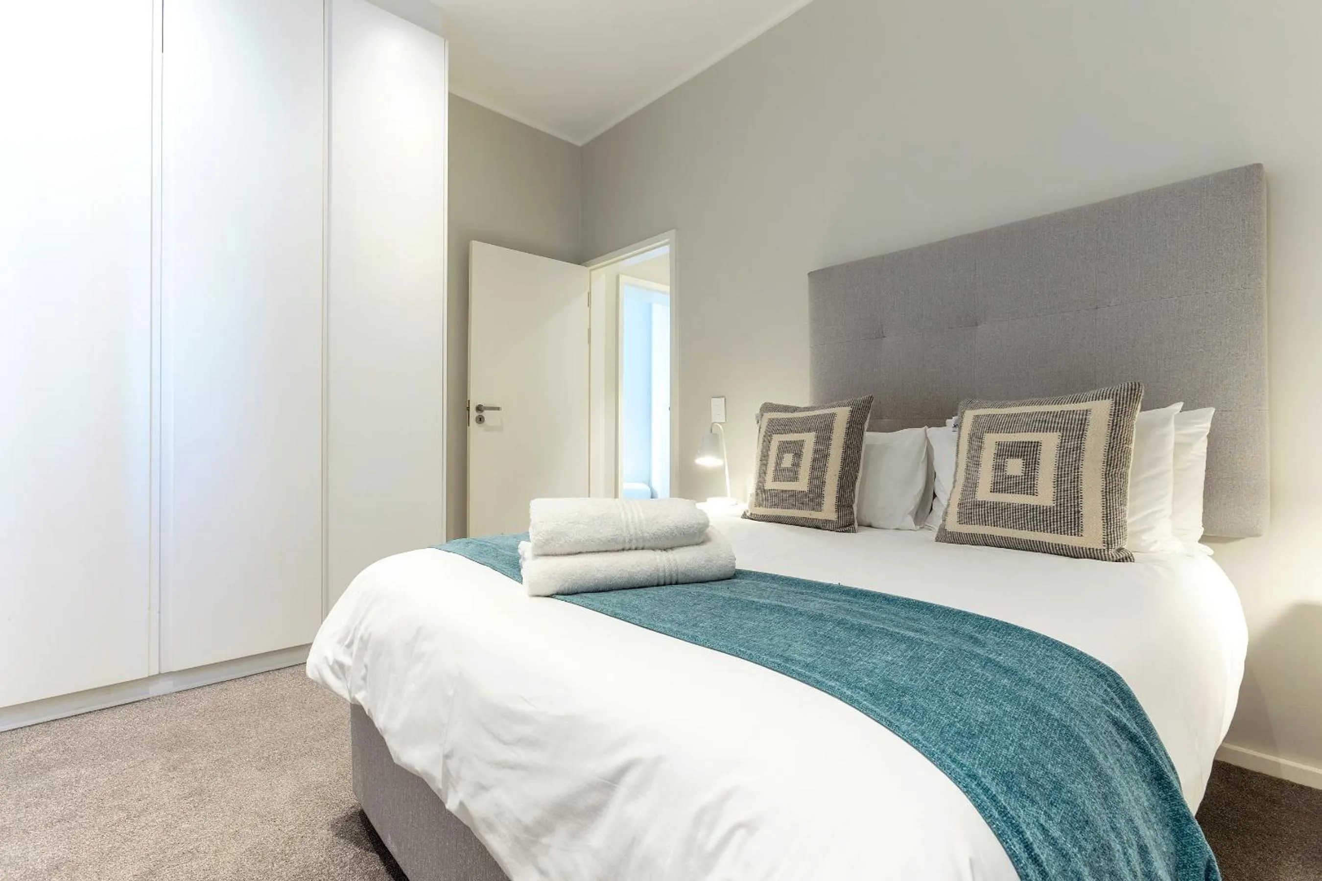 Bed in Axis Luxury Apartments by Century City Hotels