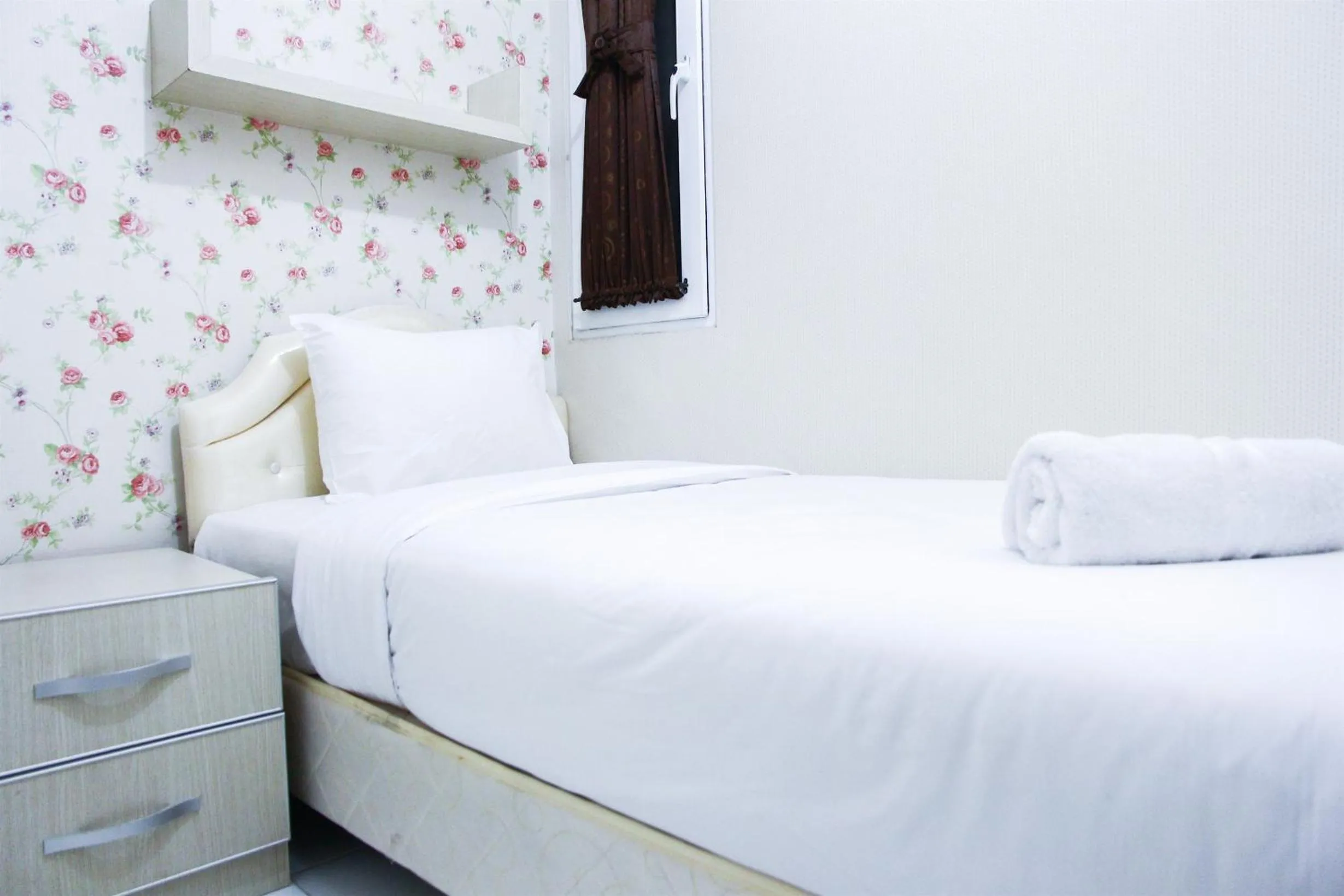 Bed in Pool View 2BR Mutiara Bekasi Apartment By Travelio