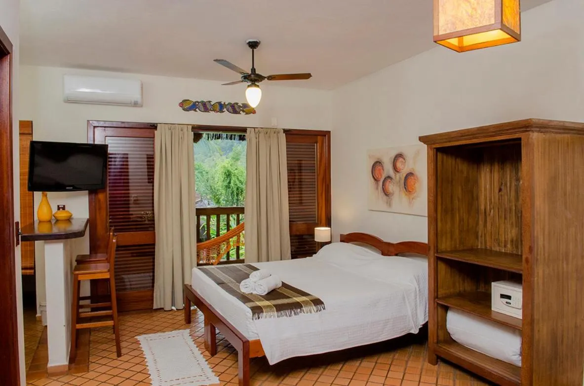 Bed in Pousada Bico Verde