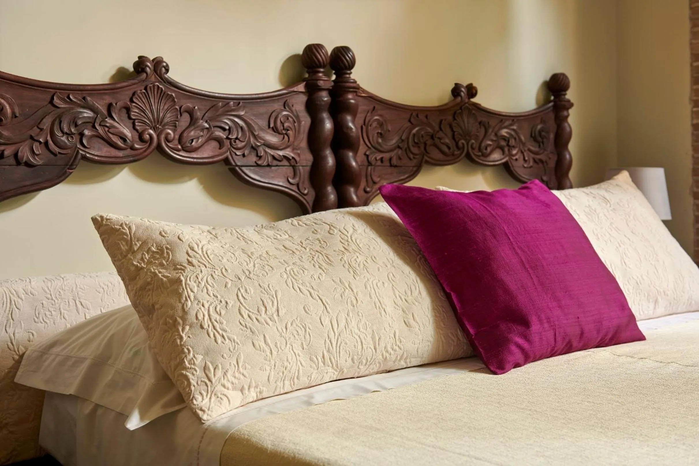 Bed in Palm Gallery Hotel