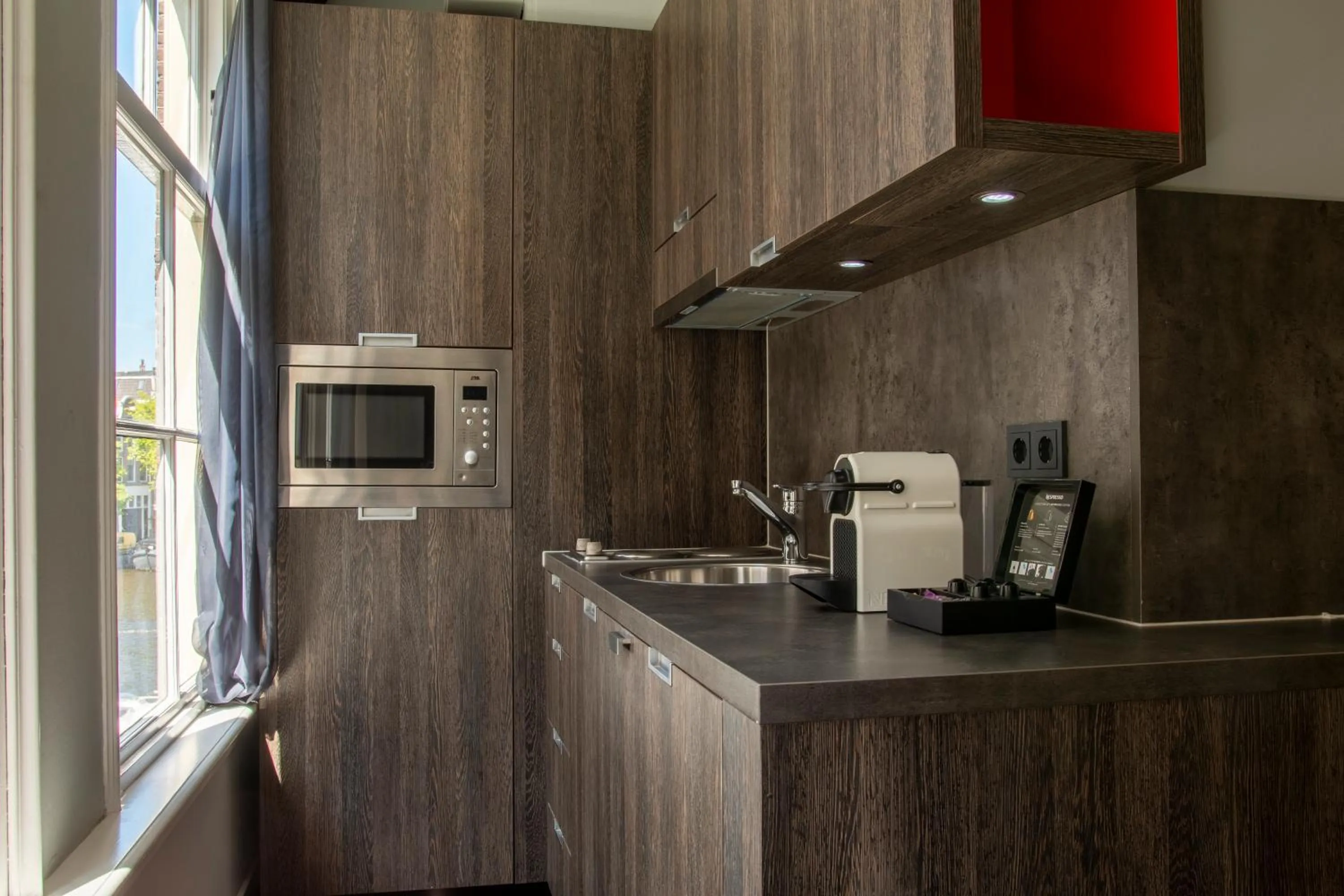 Kitchen or kitchenette in Eden Studios and Apartments