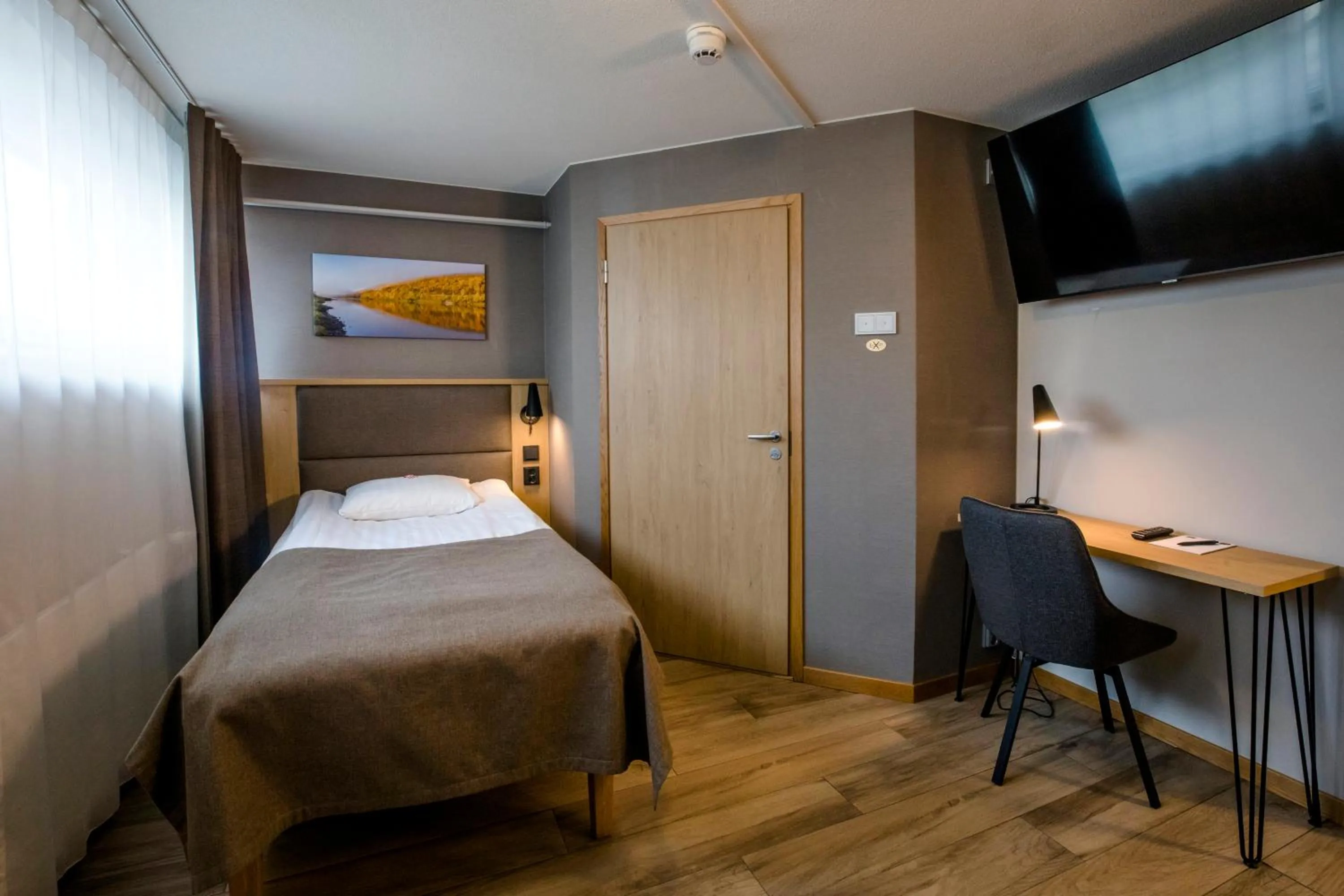 Photo of the whole room, Bed in Hotelli Toivola