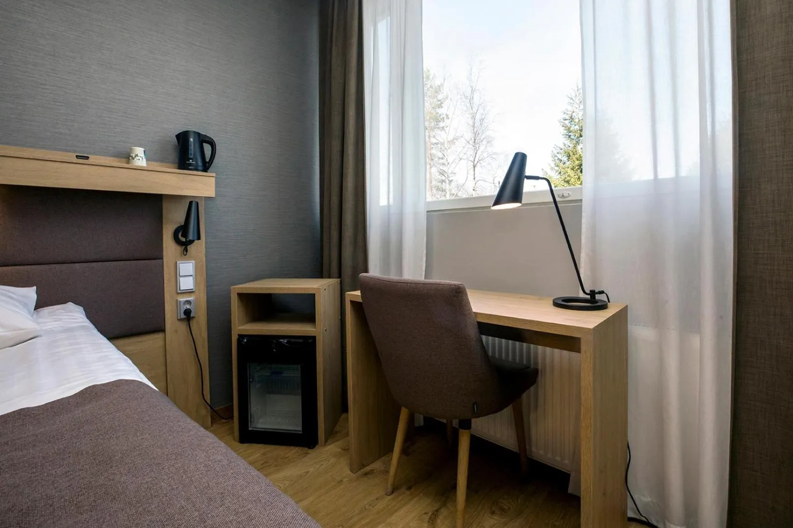 Photo of the whole room, Bed in Hotelli Toivola