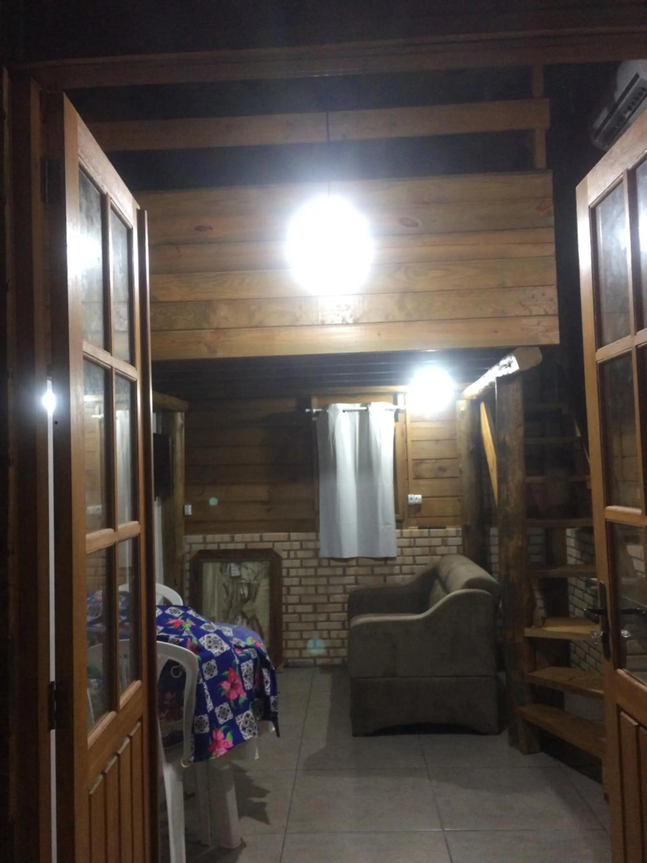 Living room in Mandala Chalés