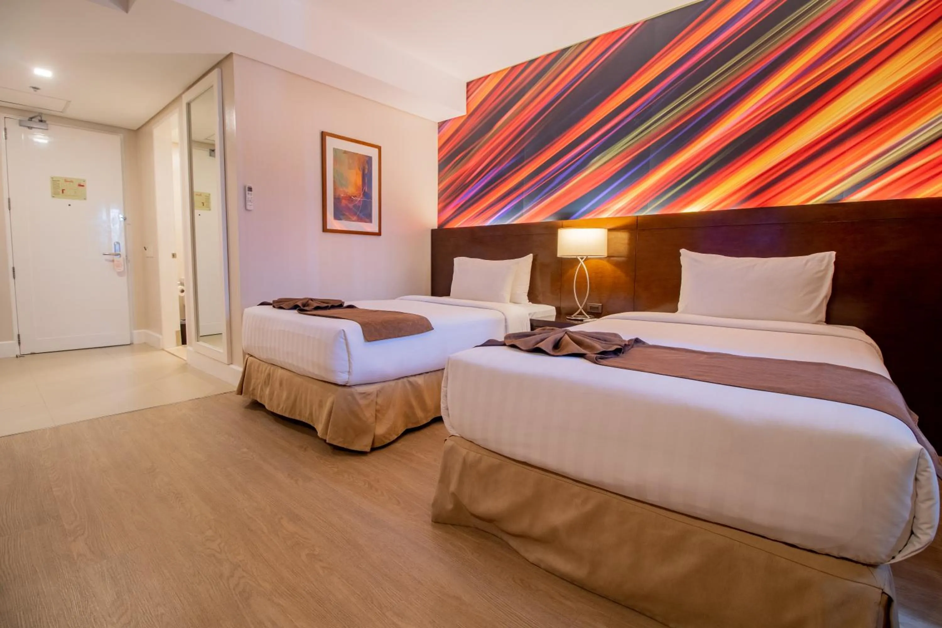 Photo of the whole room, Bed in Harolds Hotel Cebu