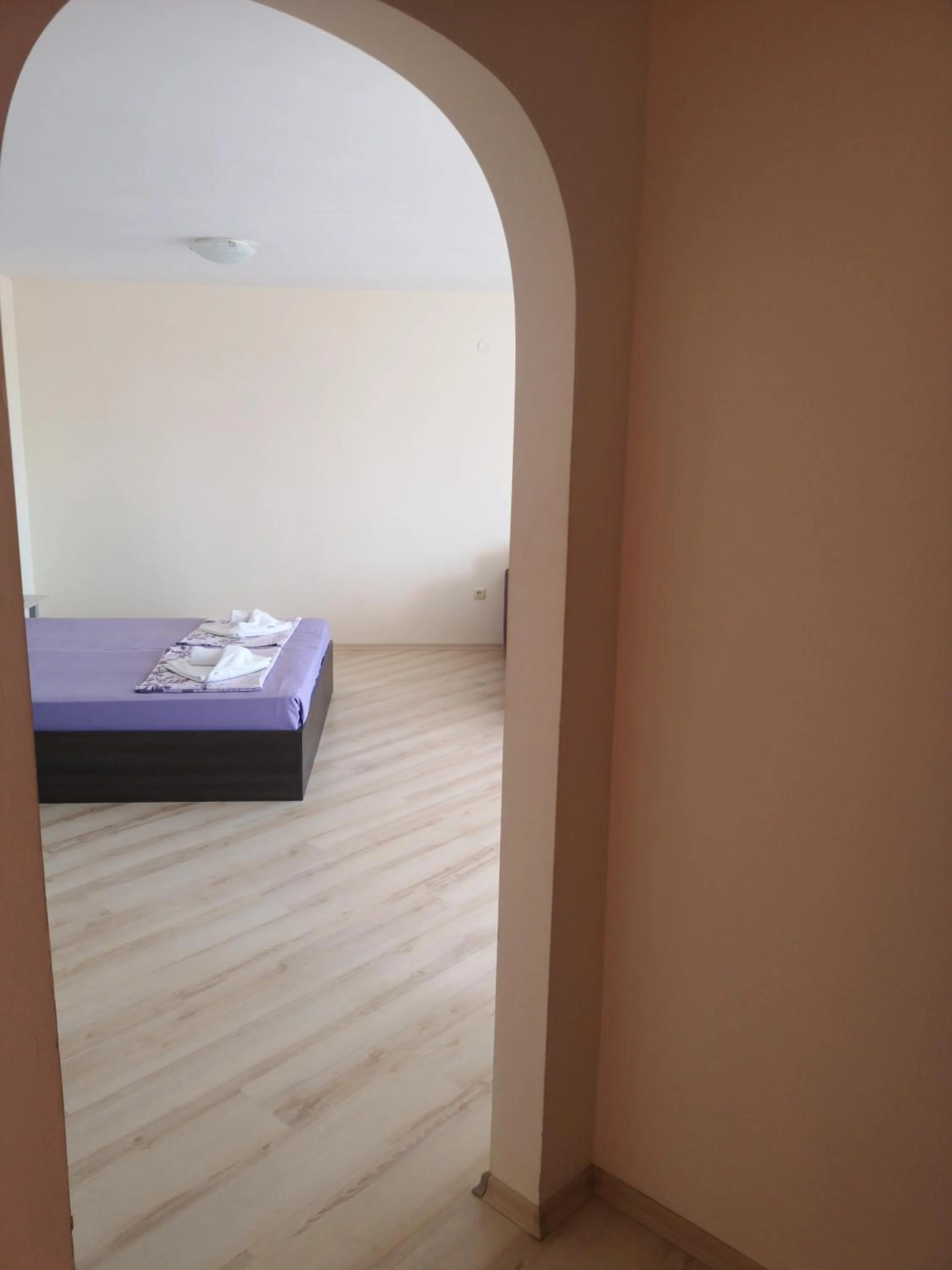 Bed in Rose Garden Omax Apartments