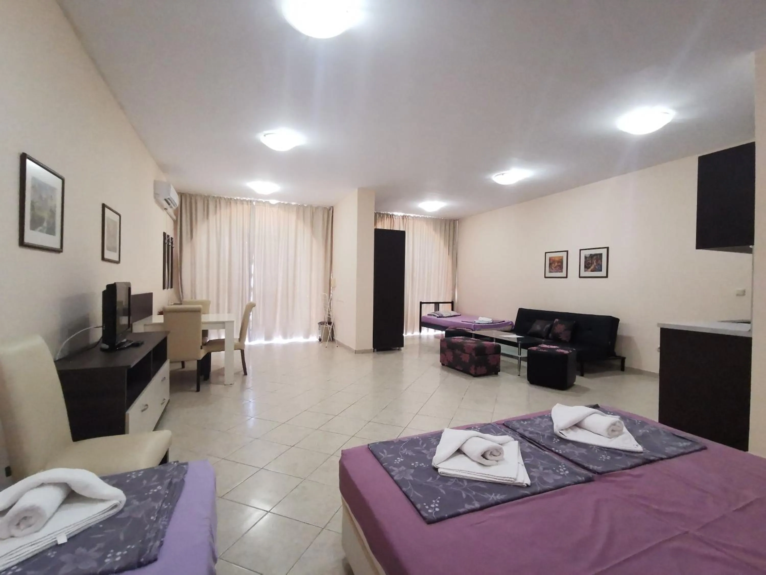 Bed in Rose Garden Omax Apartments