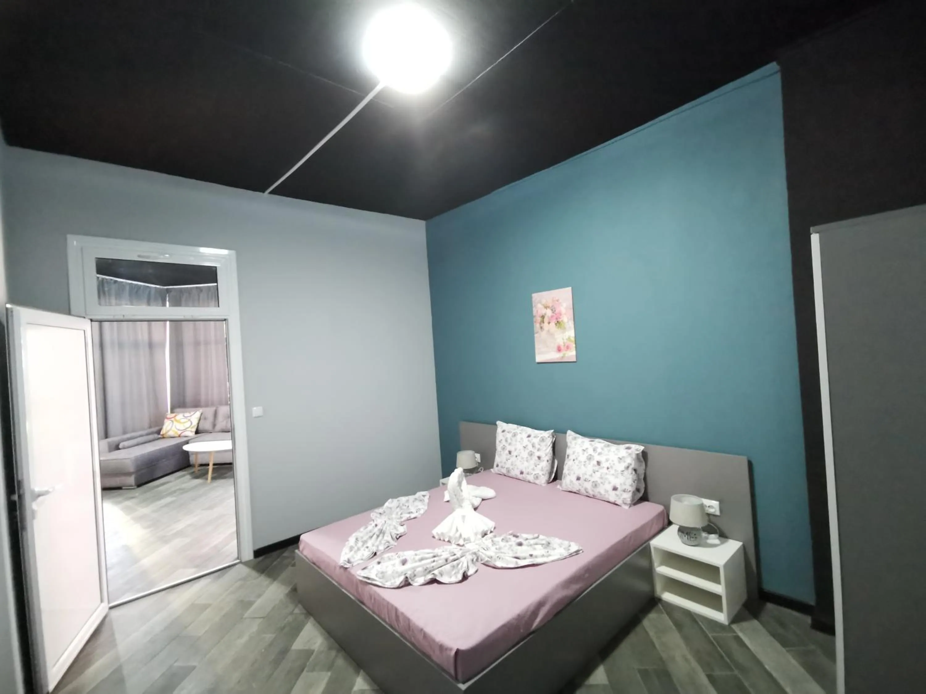 Bed in Rose Garden Omax Apartments