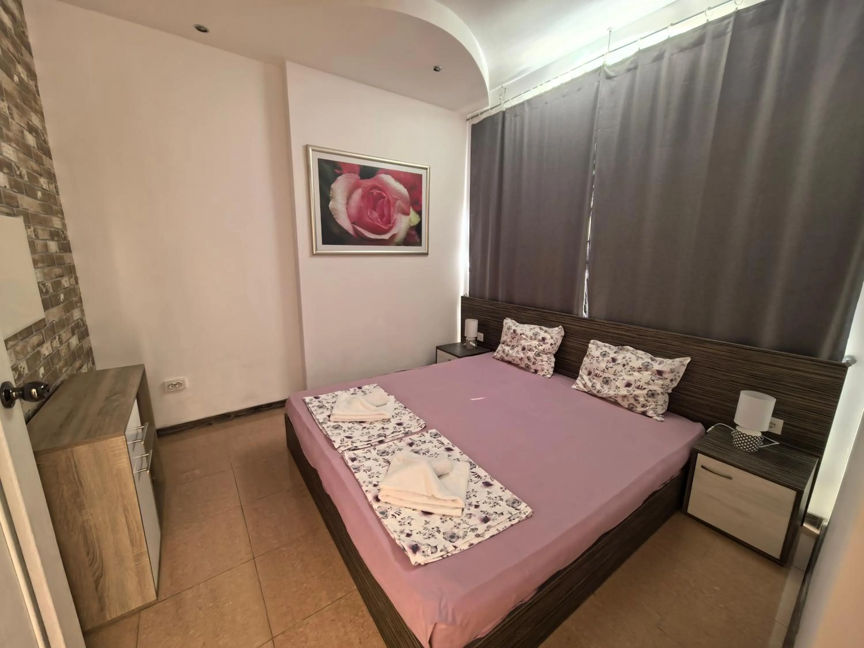 Bed in Rose Garden Omax Apartments