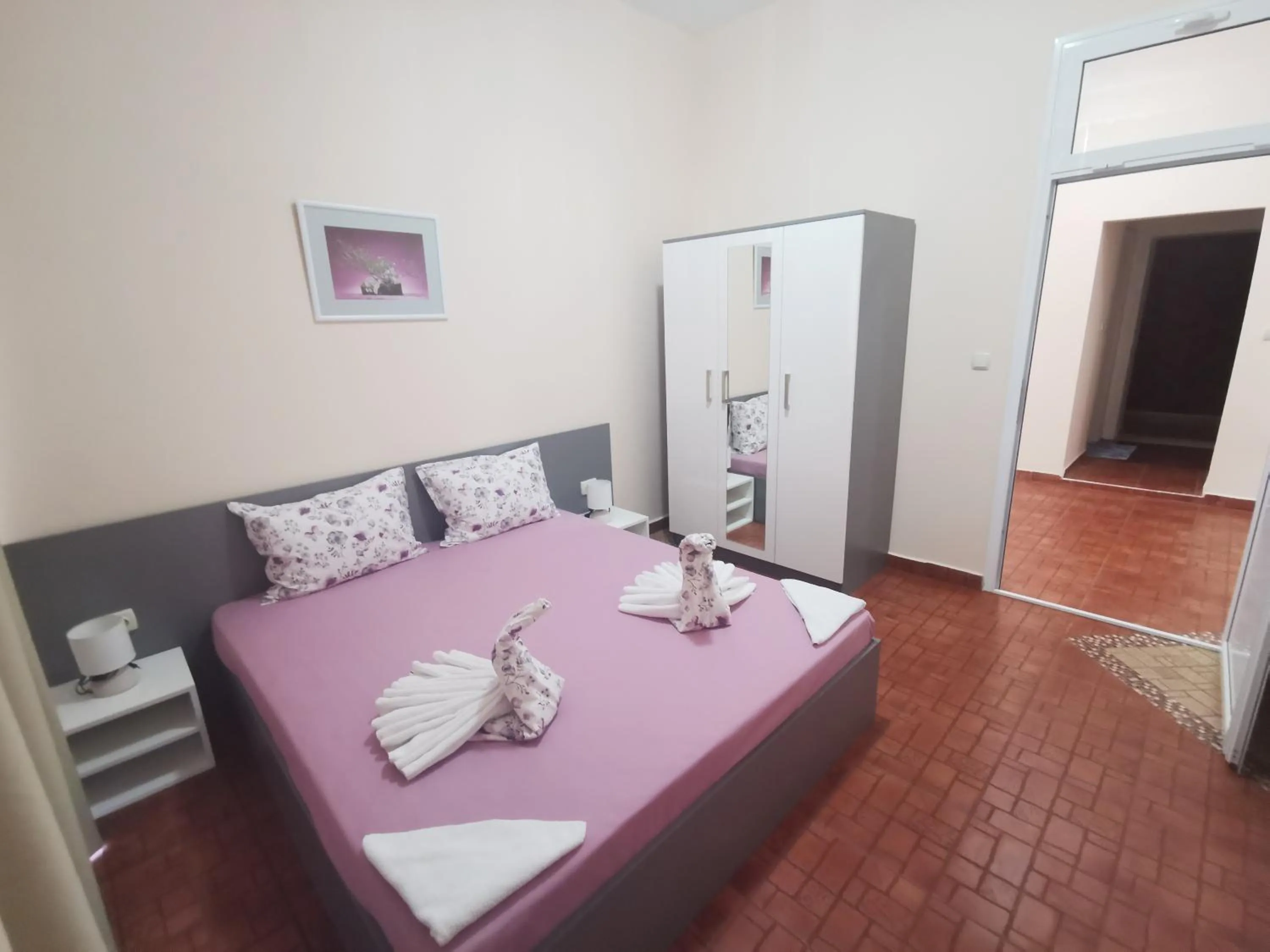 Bed in Rose Garden Omax Apartments