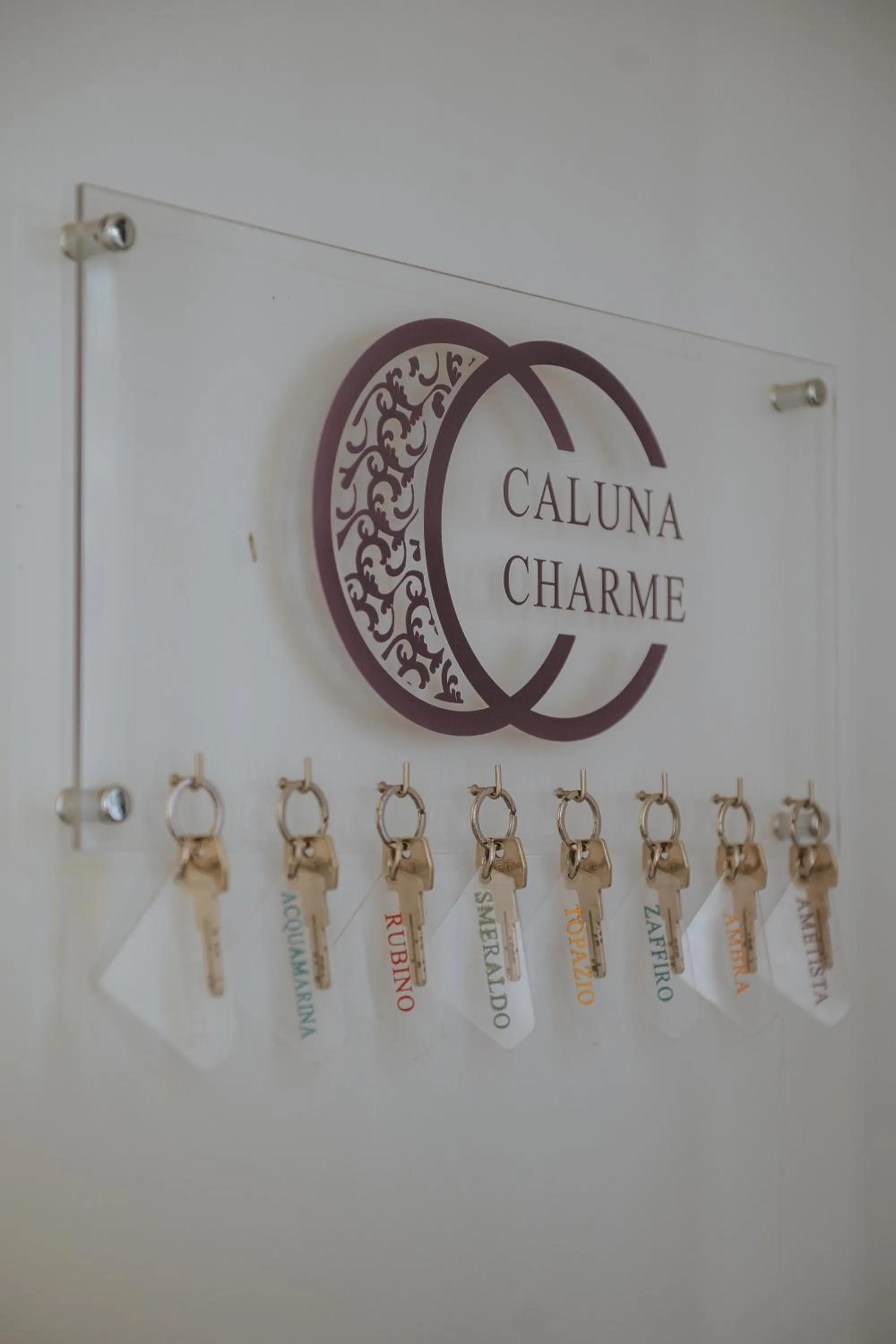 Property logo or sign in Hotel Caluna Charme