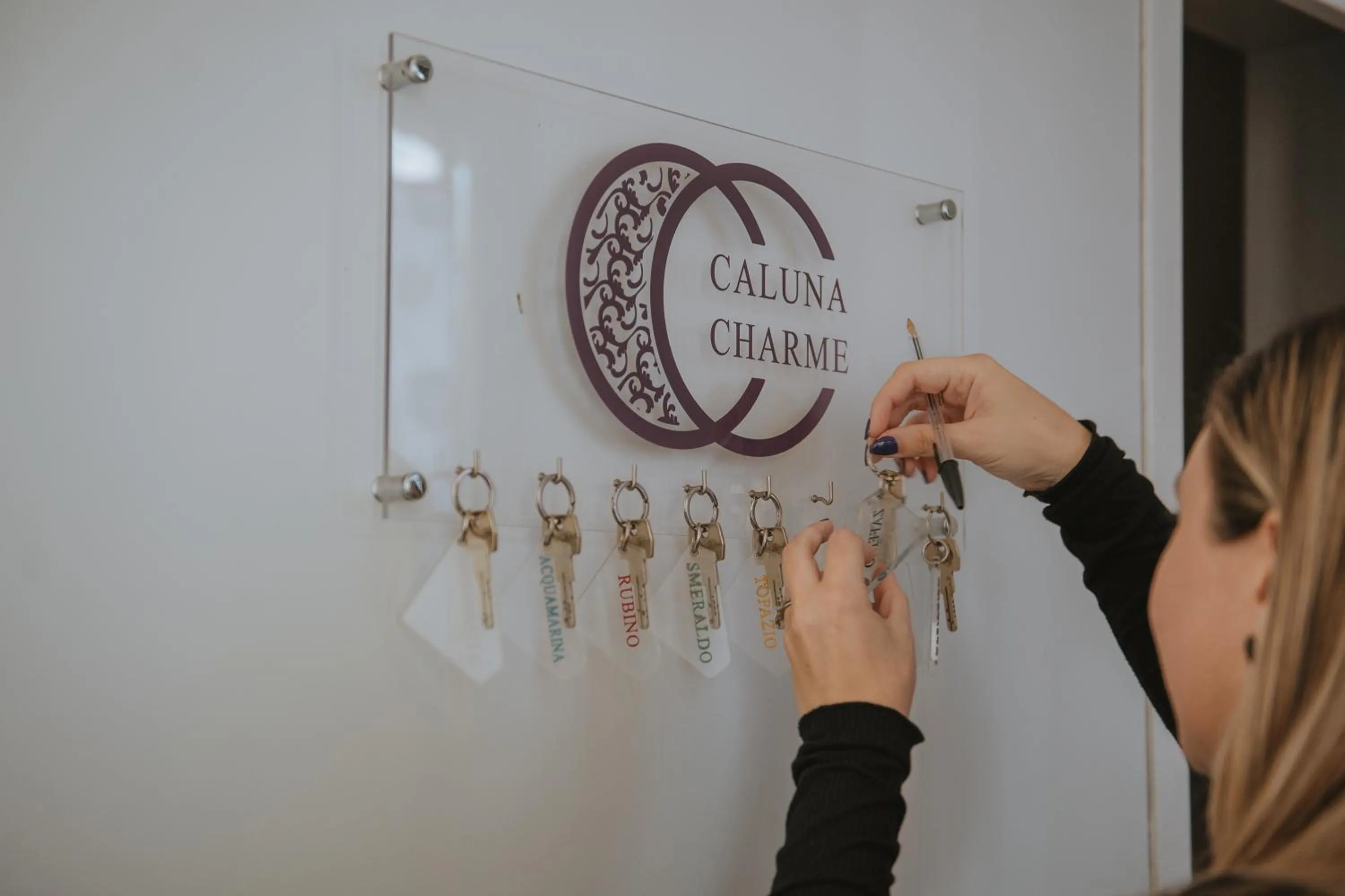 Property logo or sign in Hotel Caluna Charme
