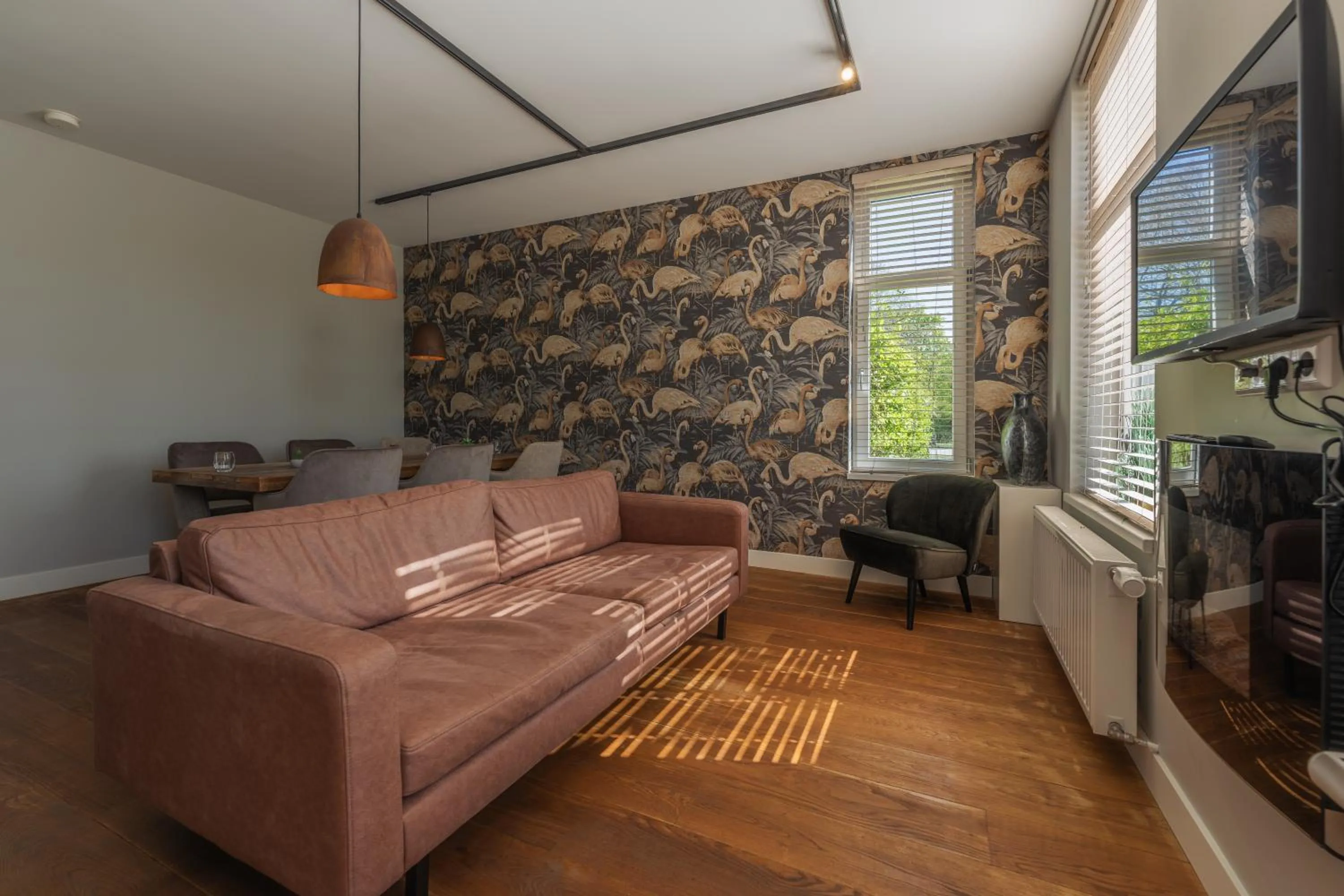 Communal lounge/ TV room in B&B Dennenbos