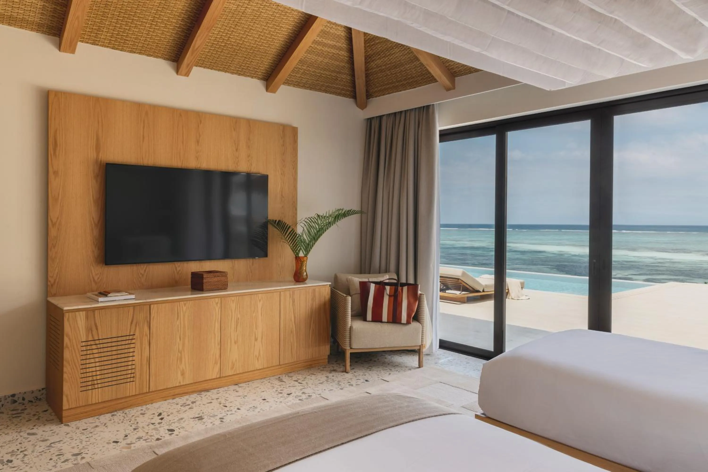 Communal lounge/ TV room, Bed in Melia Zanzibar