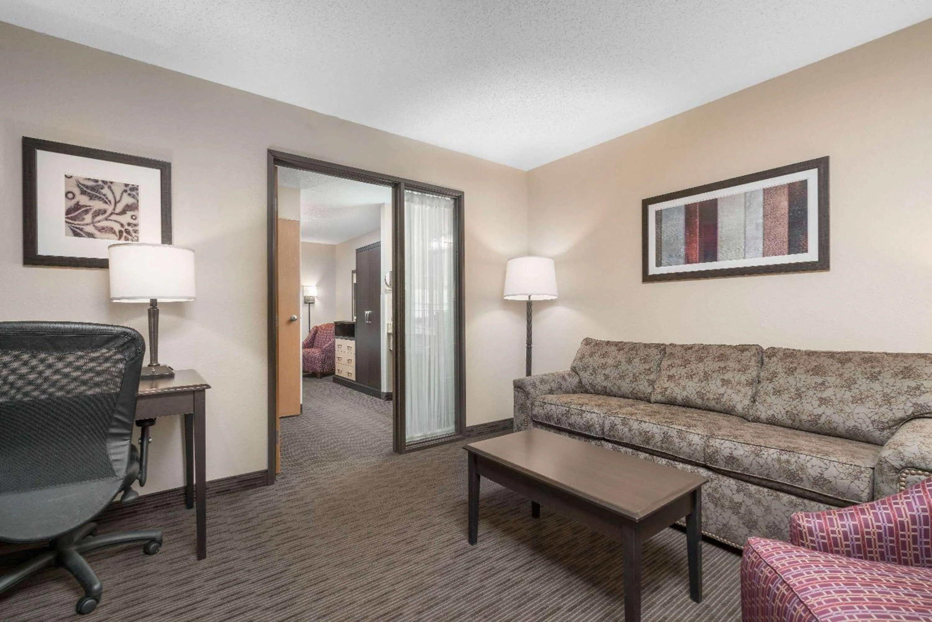 Living room in AmericInn by Wyndham Detroit Lakes