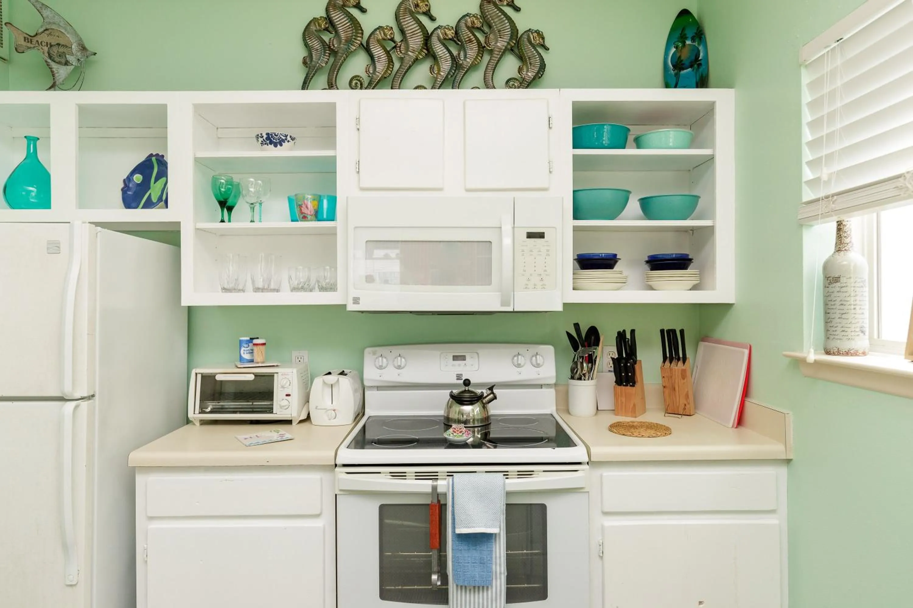 kitchen in Charming family condo - walking distance to beach by Mustang Island, Sleeps Four, 2025 Traveler Award