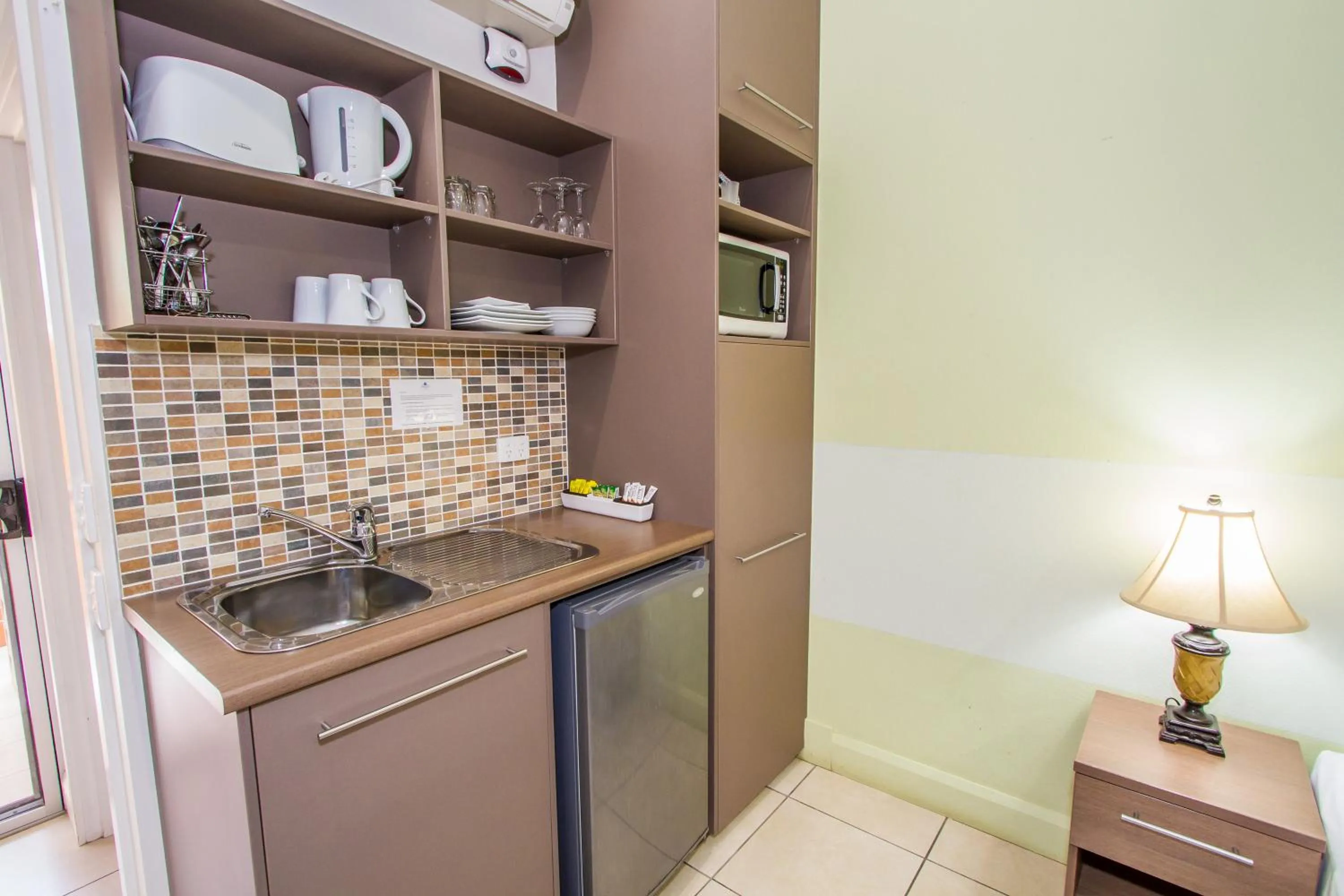 Kitchen or kitchenette in Sandcastles 1770 Motel & Resort