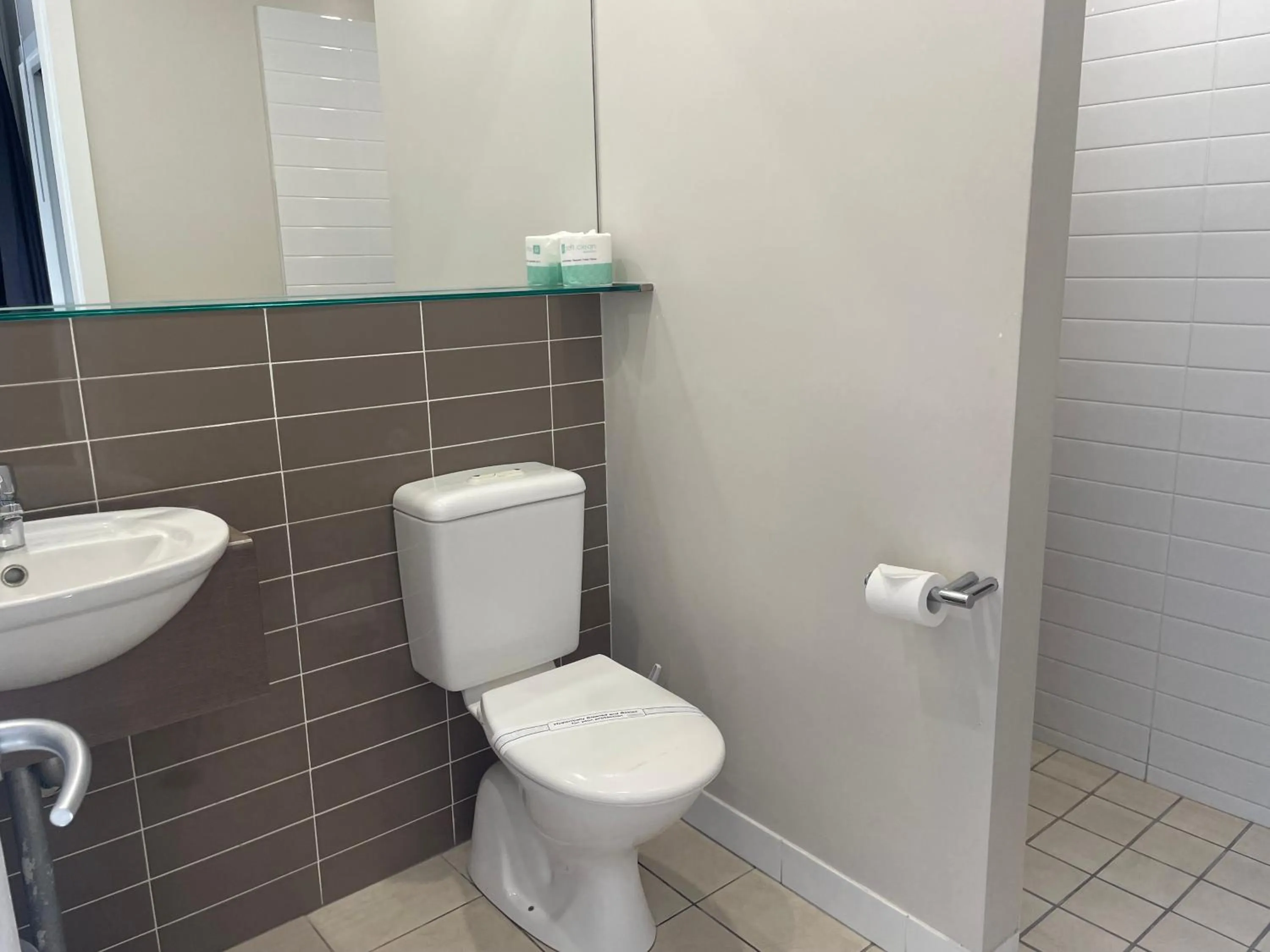 Toilet in Sandcastles 1770 Motel & Resort