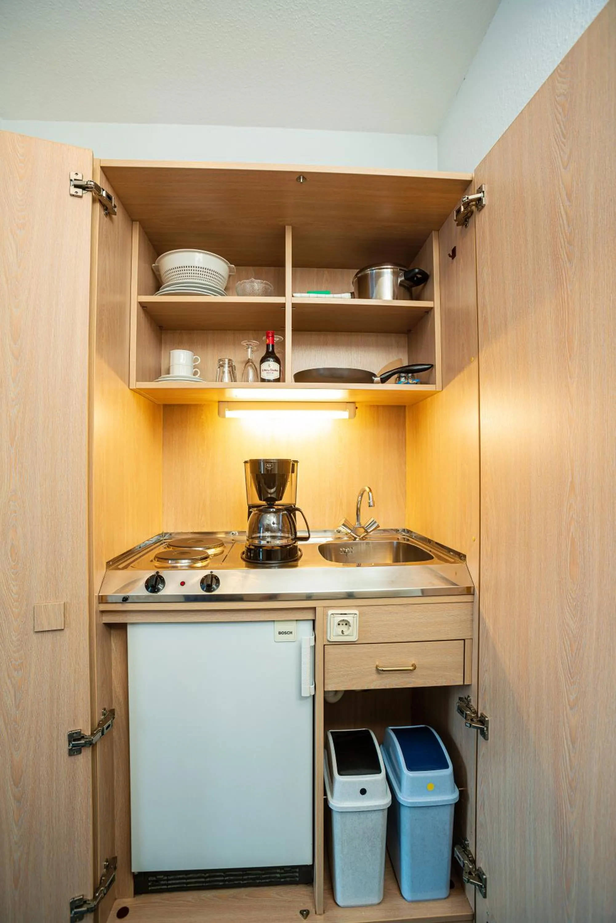 Kitchen or kitchenette in Apart' Hotel