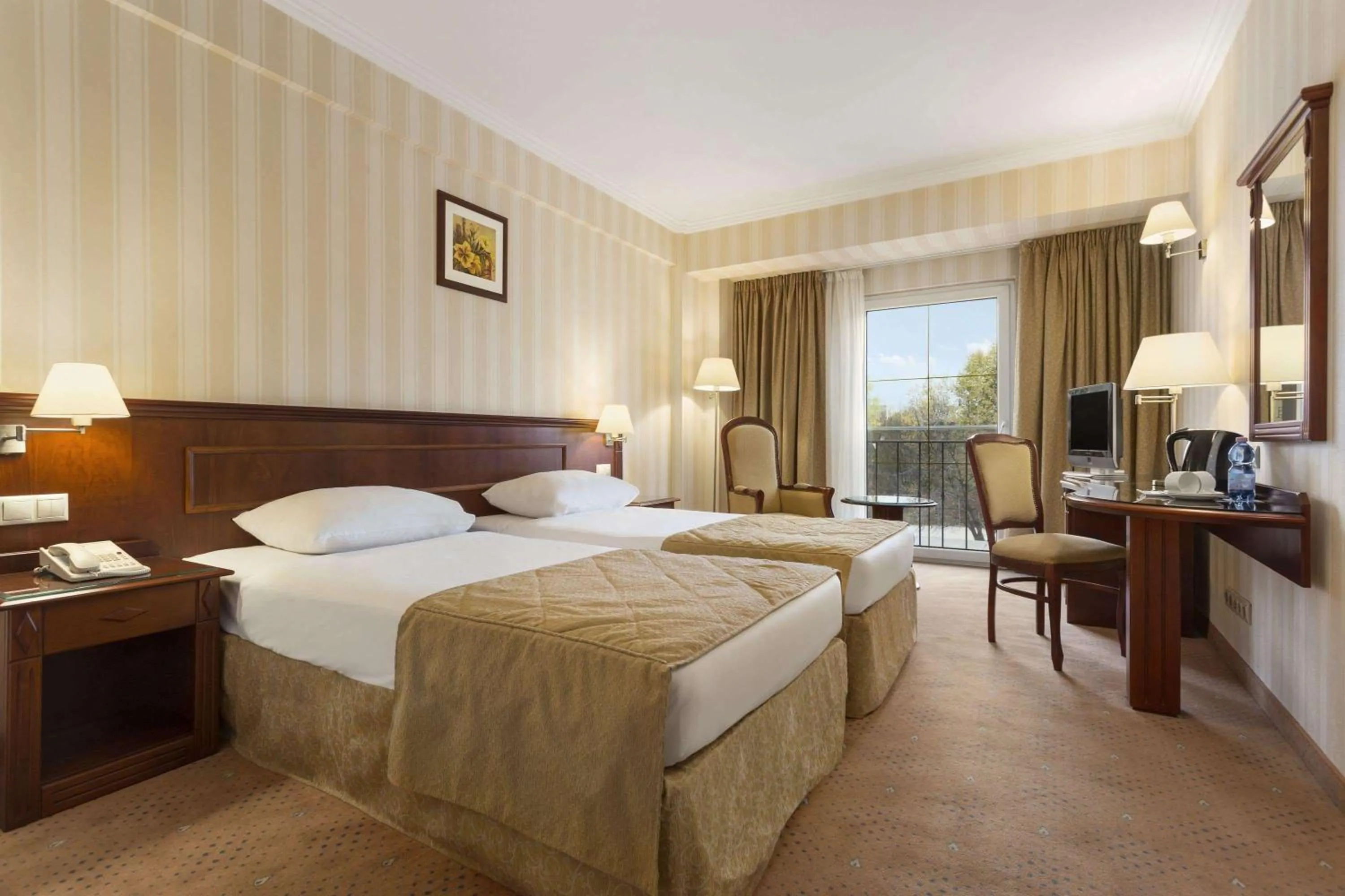 Photo of the whole room, Bed in Ramada Hotel & Suites by Wyndham Bucharest North