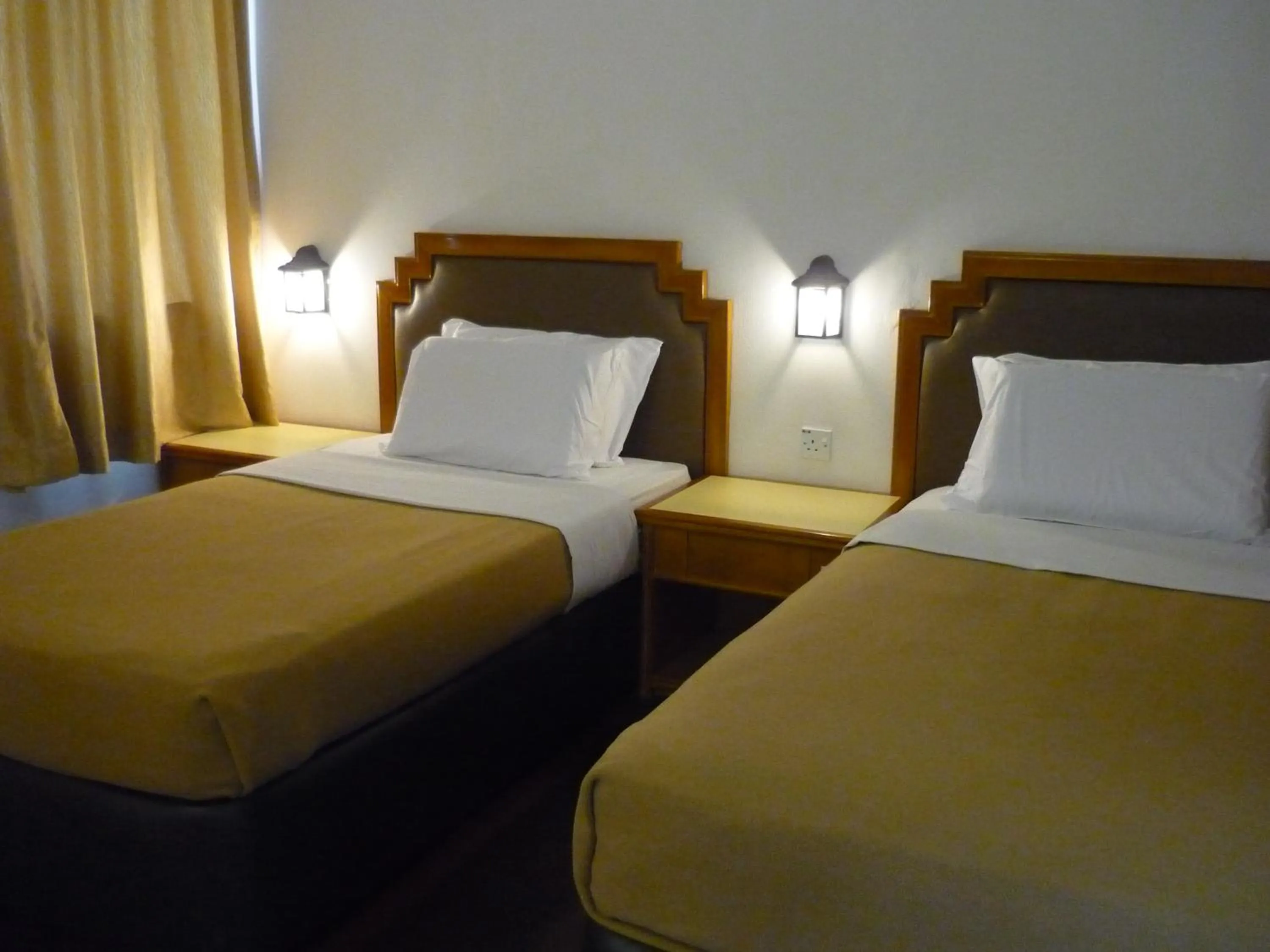 Bed in Kinabalu Pine Resort