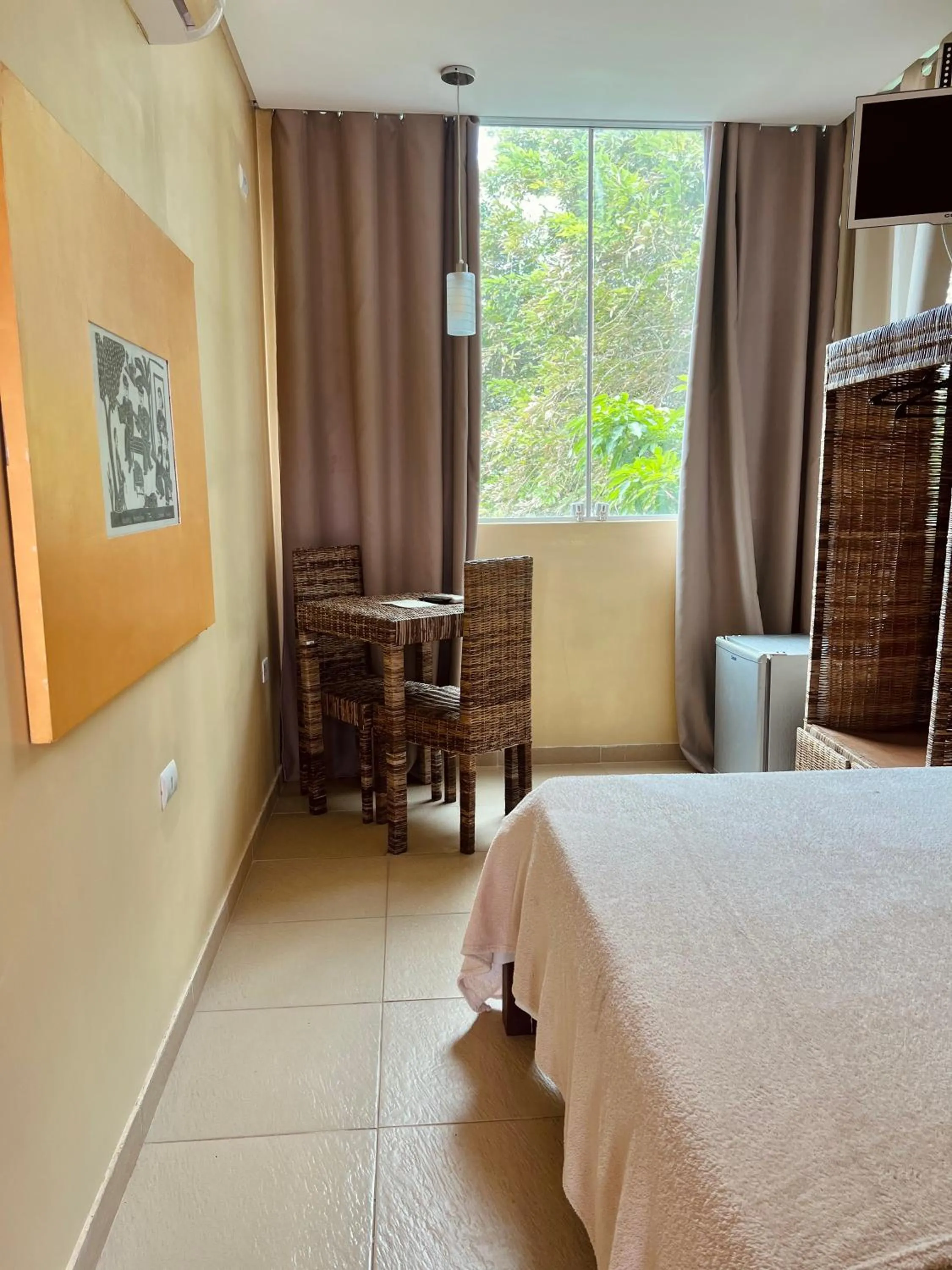 Bed in Pousada Costa Tropical