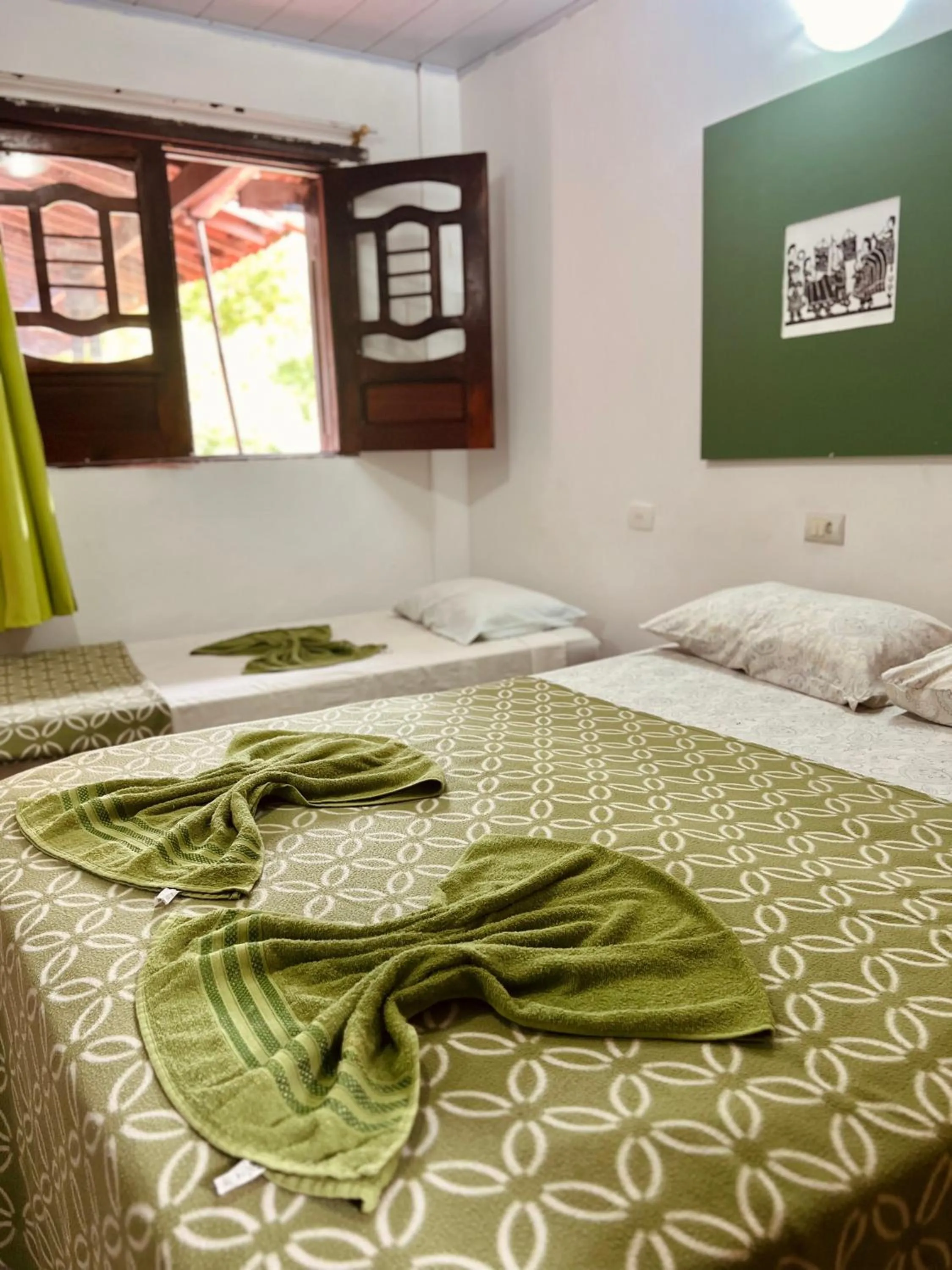 Bed in Pousada Costa Tropical