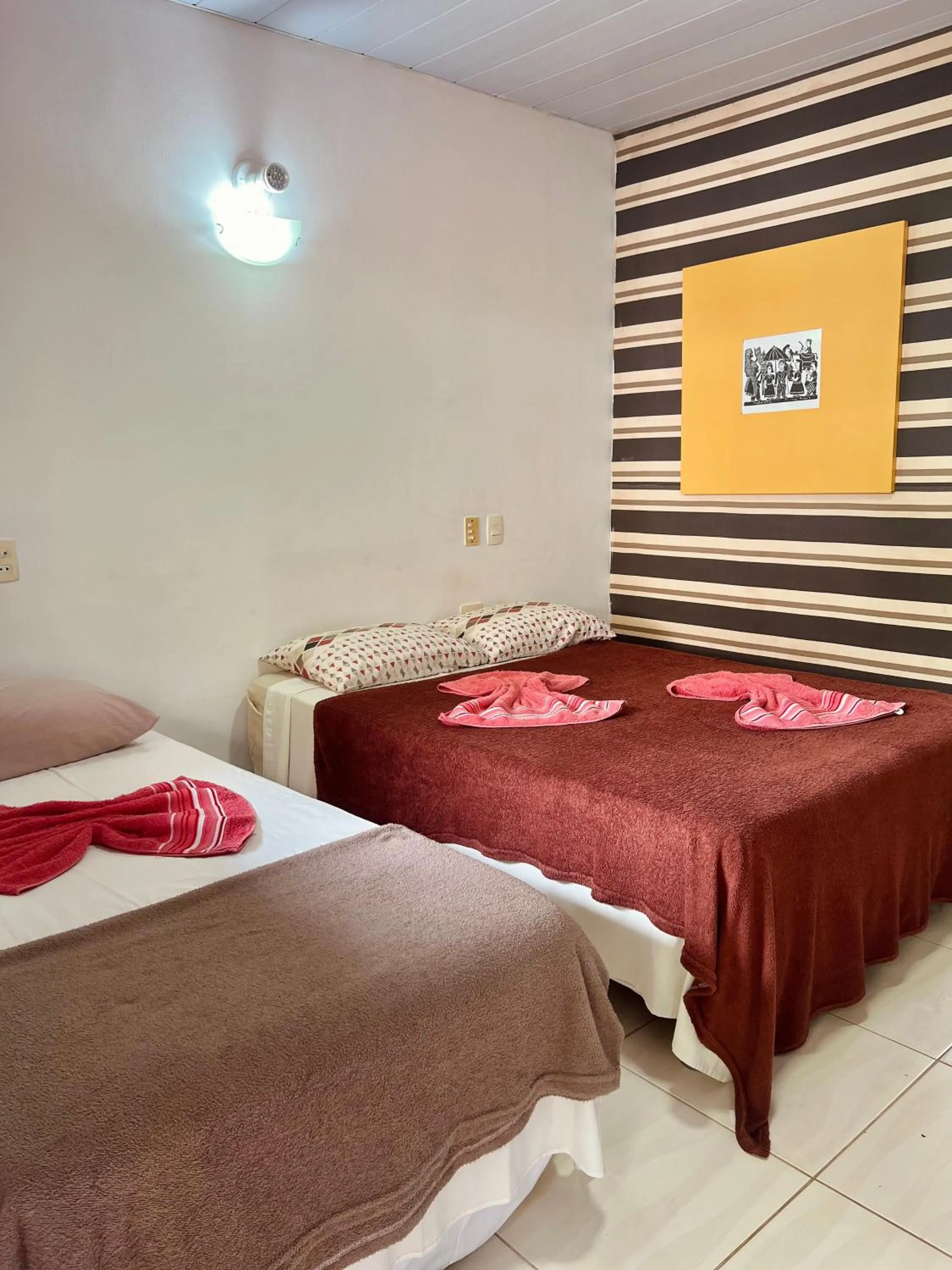 Bed in Pousada Costa Tropical