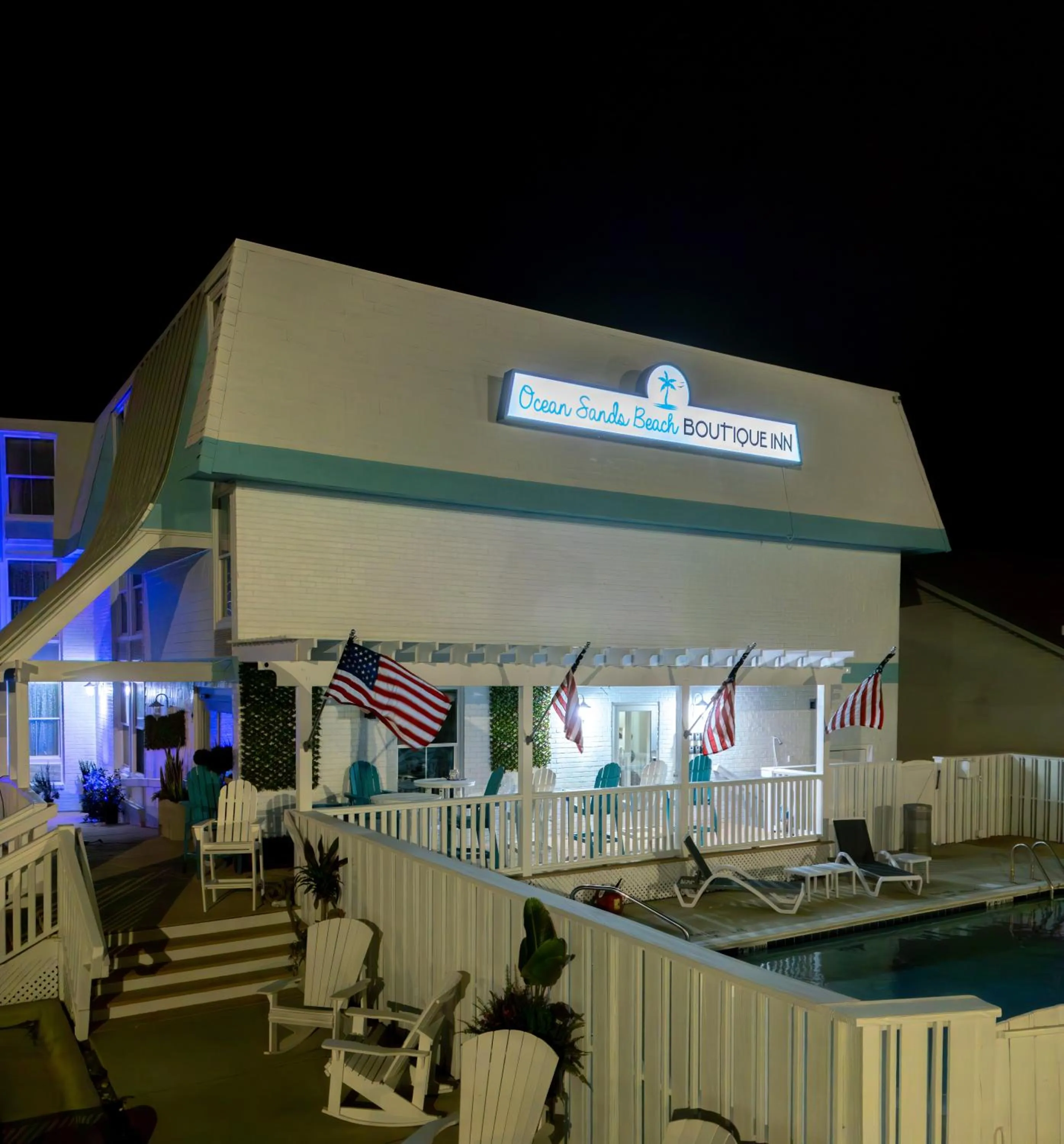 Property building in NEW 2026-Ocean Sands Beach Boutique Inn-Sauna and Salt-Mineral Pool -Free Beach Bikes and Famous Beach- Fresh Baked Cookies and Popcorn - Bathrobes and Sunscreen in all rooms-Ultra Sparkling-Free Laundry- 4 Grand Black Beds-Call NOW & Save-1-252-AHA-SAND