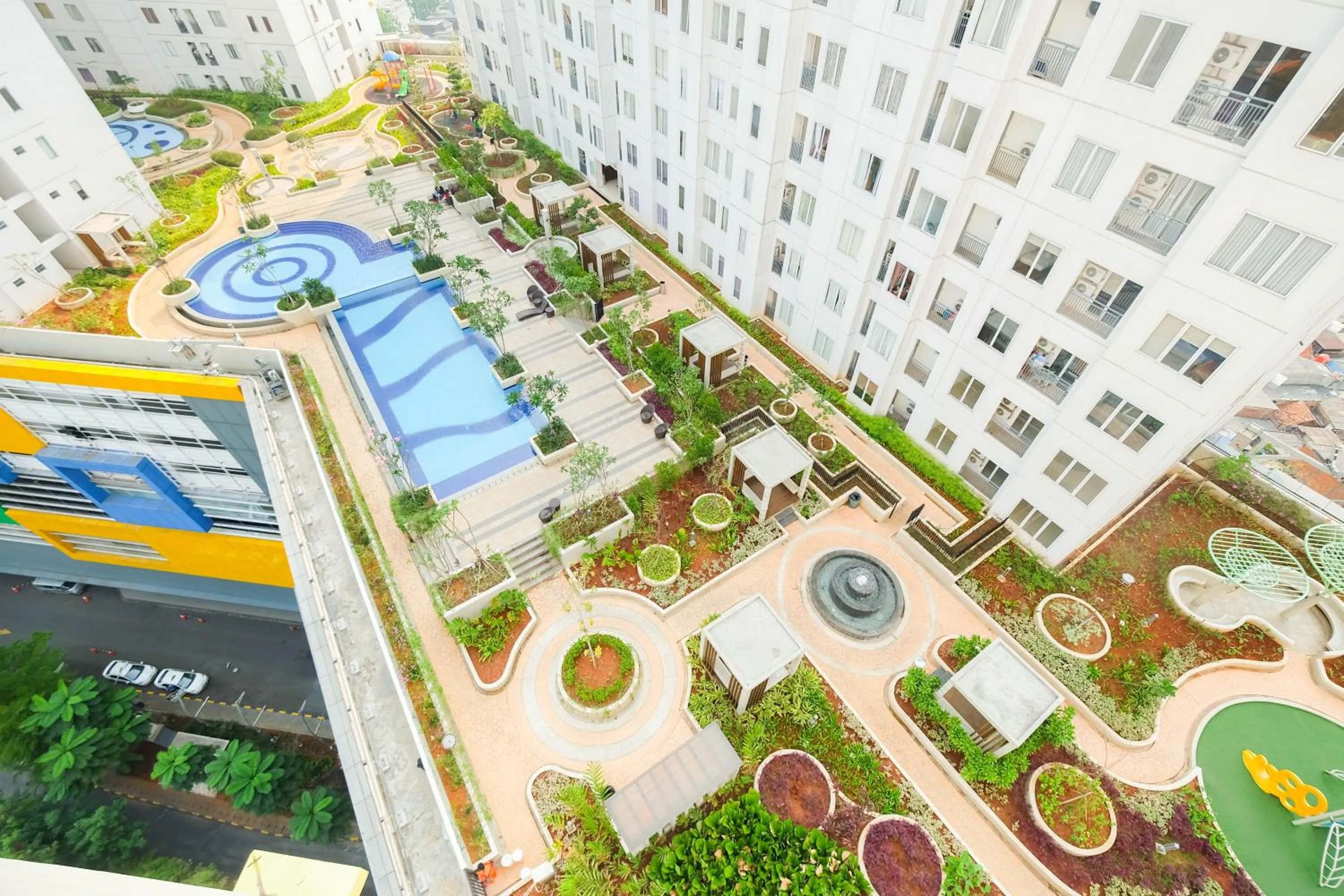 Property building in Cozy 2BR Bassura City Apartment By Travelio