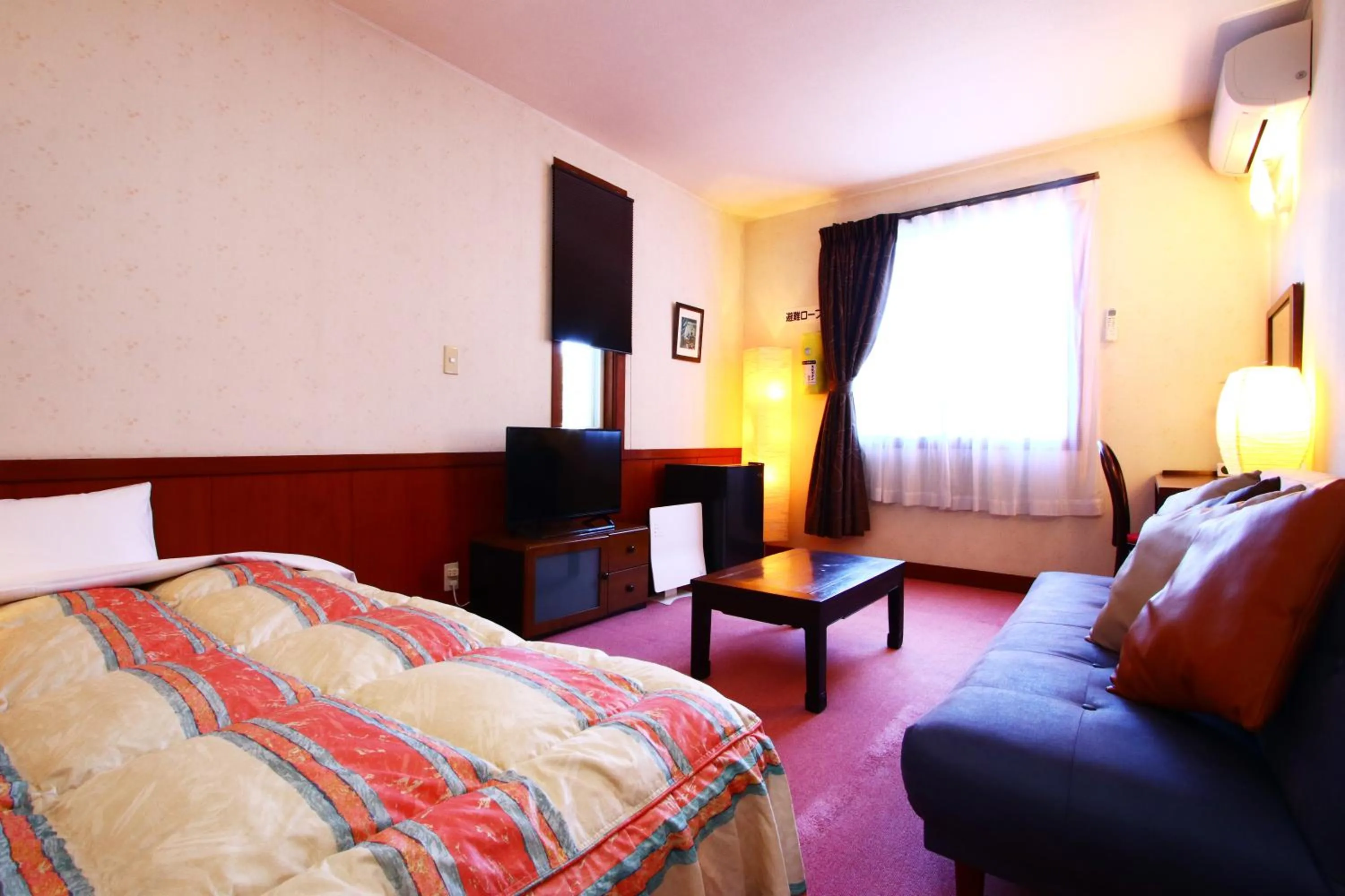 Photo of the whole room, Bed in IZUNA INN & SPA - the veggie delights