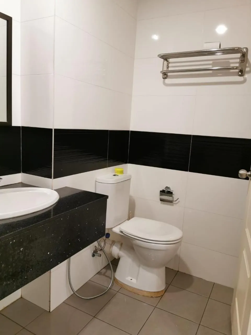 Toilet in Mansion One by Sky Hive