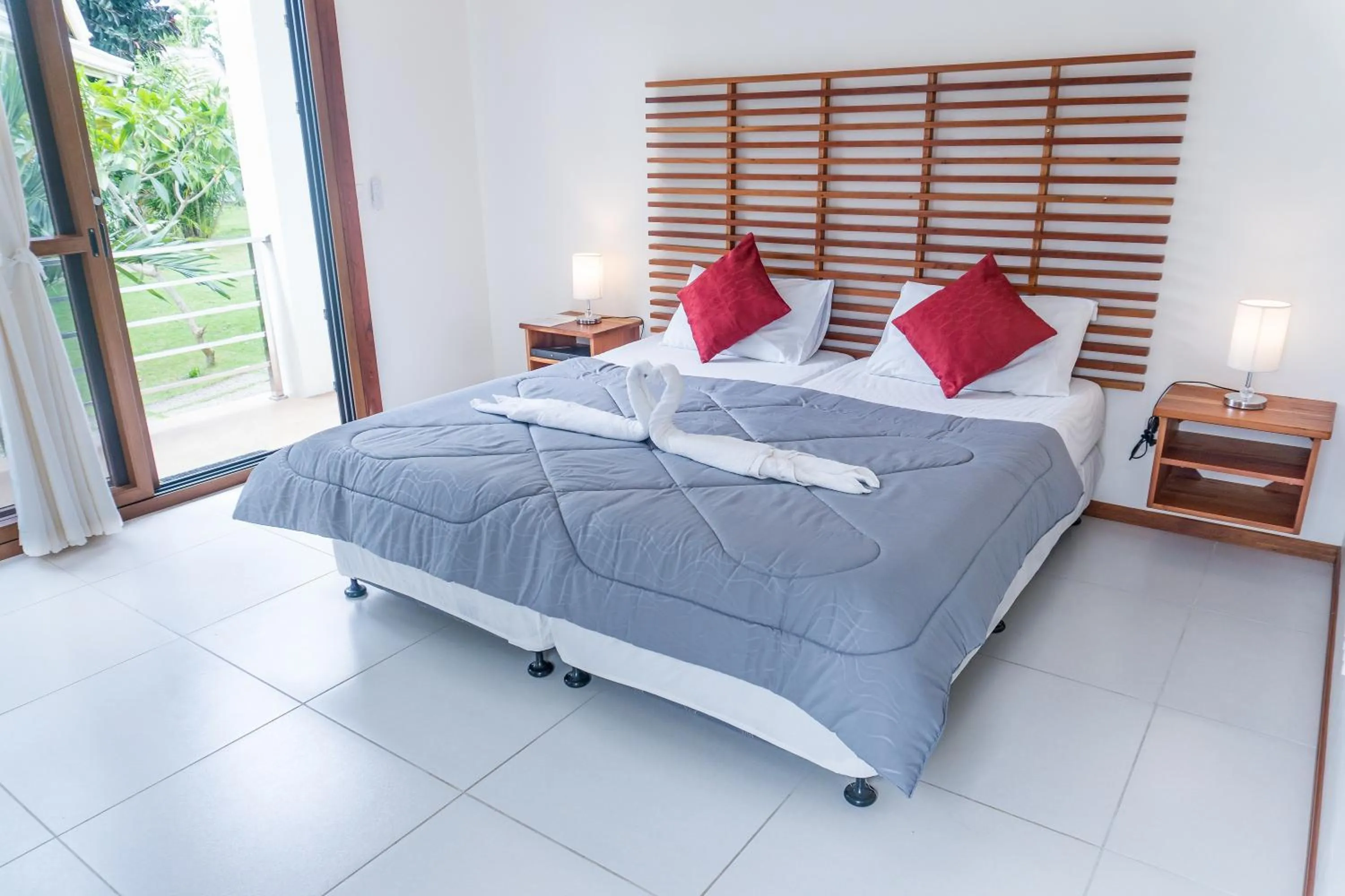 Bed in Quo Vadis Dive Resort