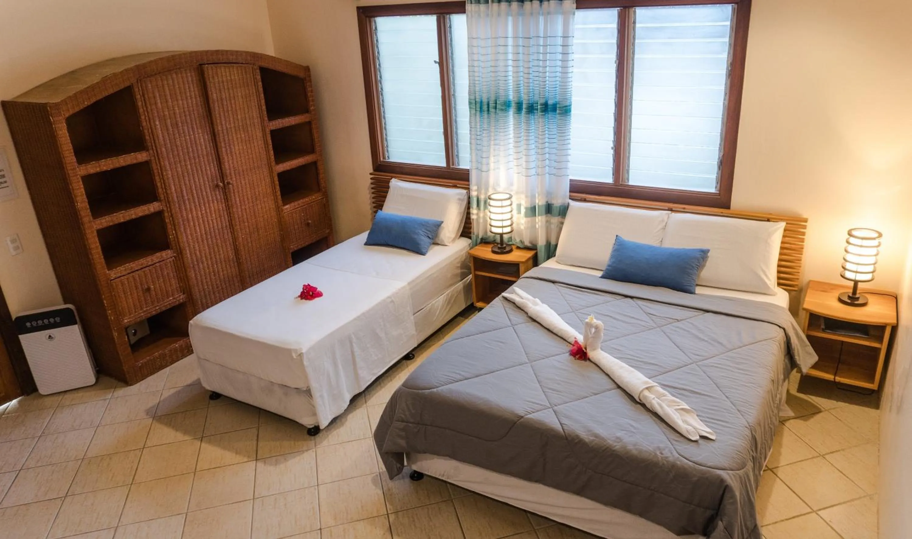 Bed in Quo Vadis Dive Resort