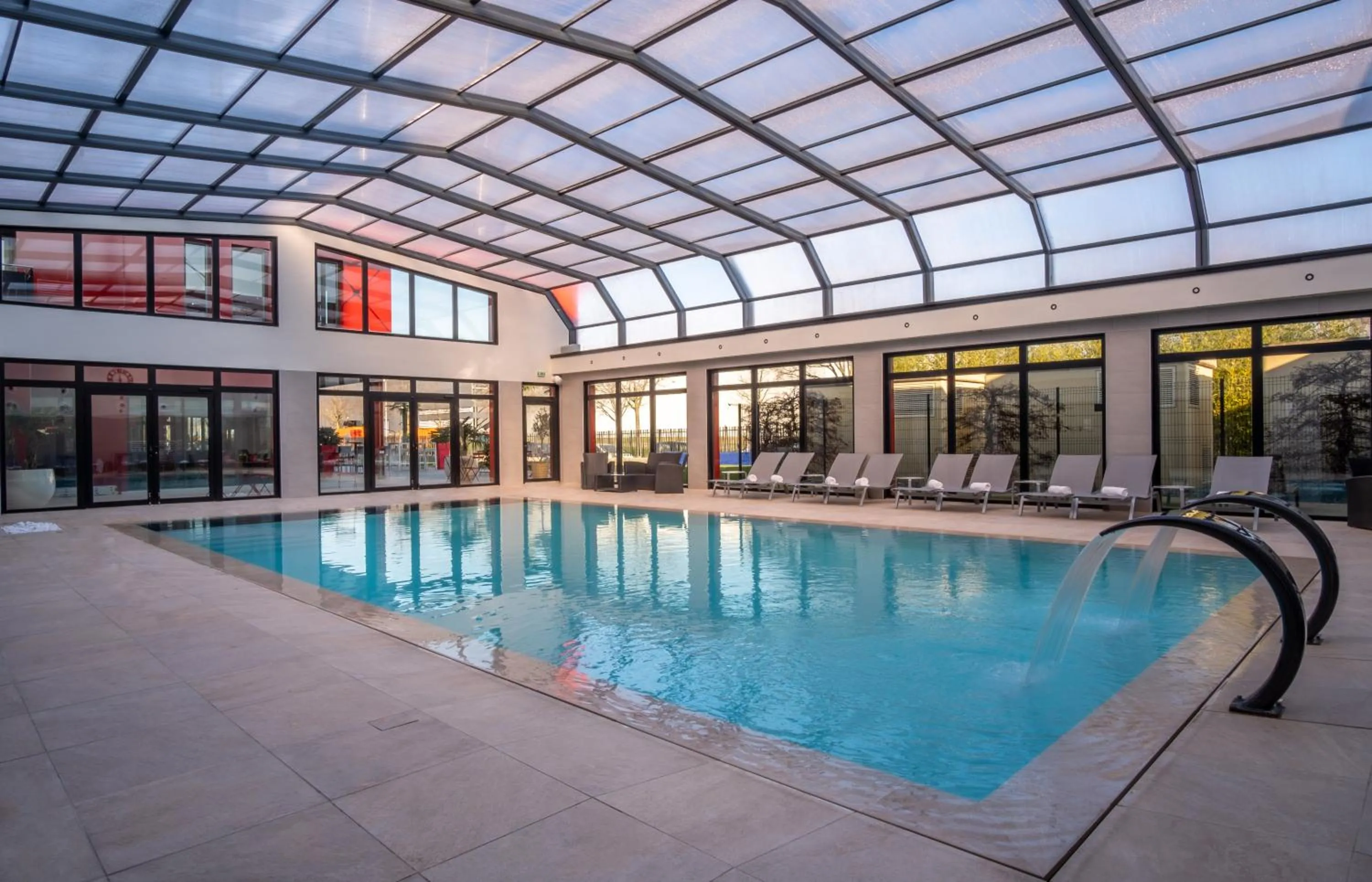 Swimming pool in Kyriad Prestige Lyon Est - Saint Priest Eurexpo Hotel and SPA
