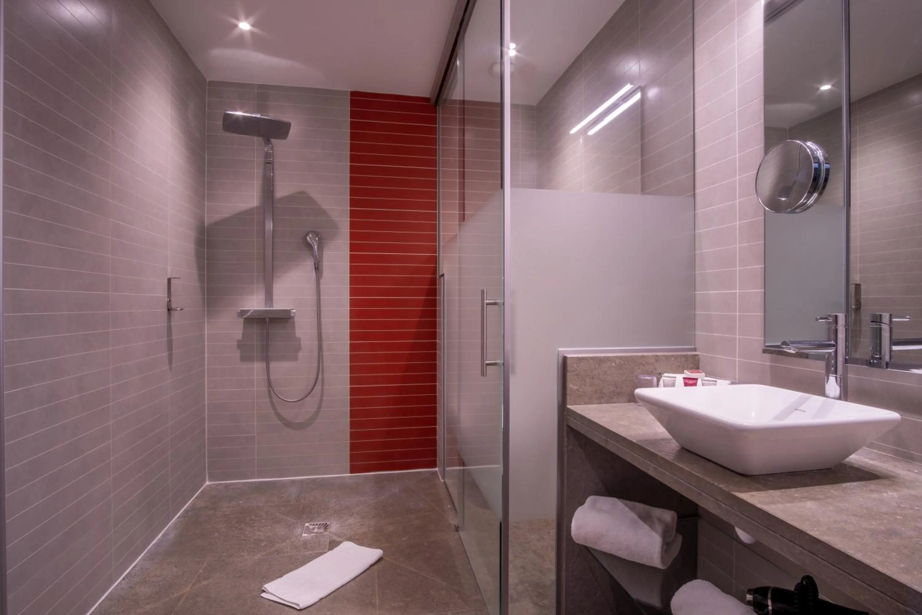 Shower in Kyriad Prestige Lyon Est - Saint Priest Eurexpo Hotel and SPA