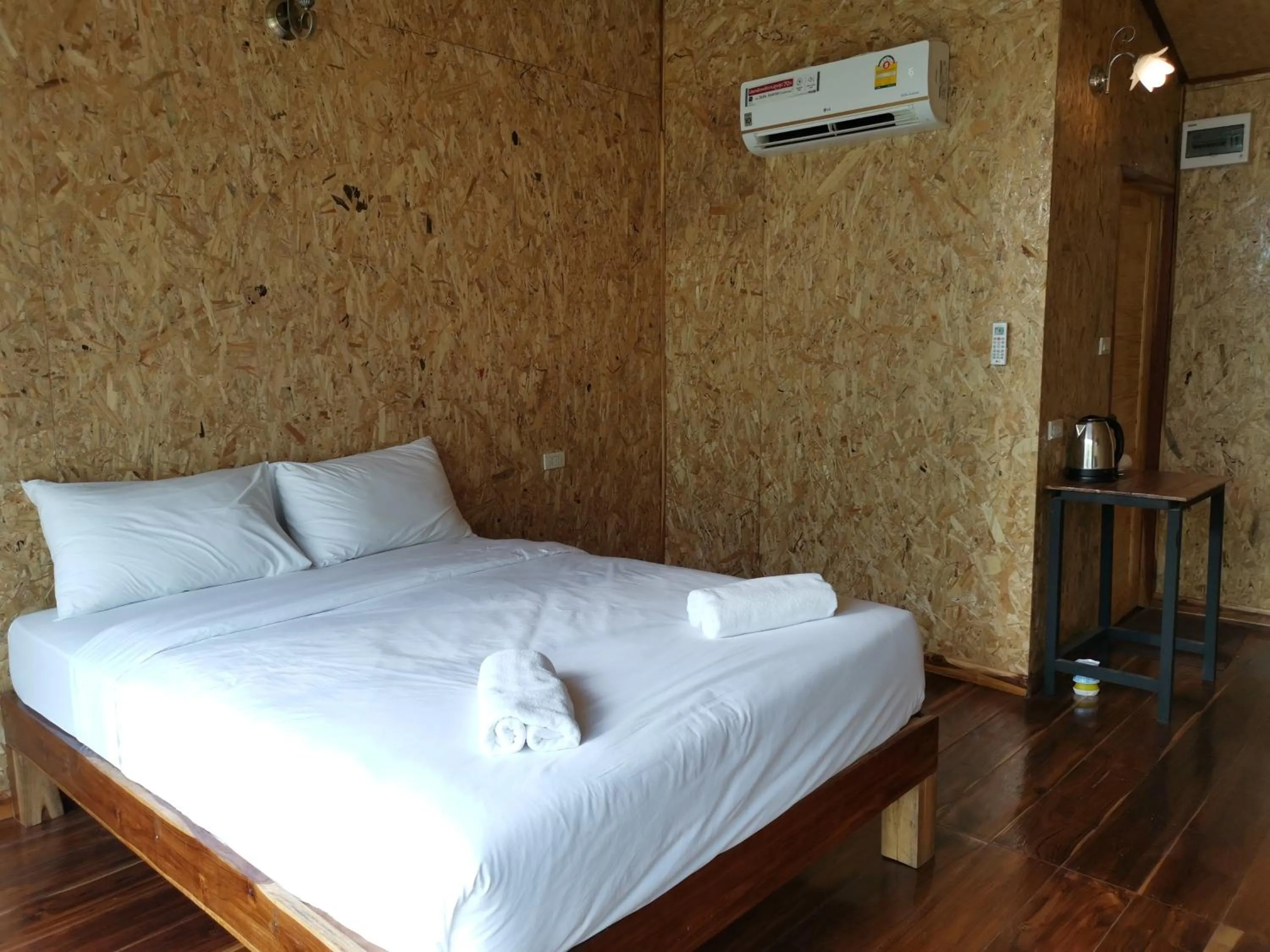 Bed in Kodaun River Kwai Resort