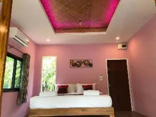 Bed in Kodaun River Kwai Resort