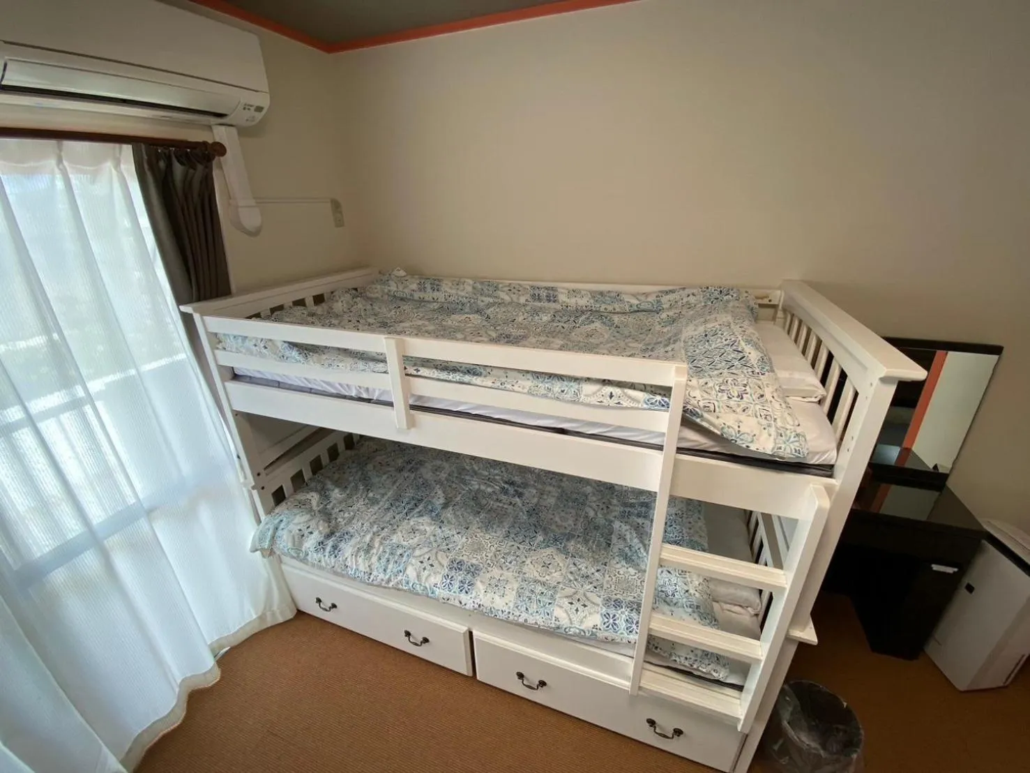 Bed in Yenn's Marina Inn Zamami Condominium