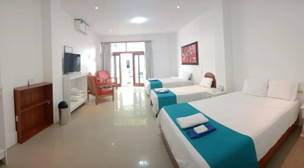 Deluxe Quadruple Room - single occupancy in Galápagos Isabela Hotel Loja Deluxe Quadruple Room - single occupancy in Galápagos Isabela Hotel Loja