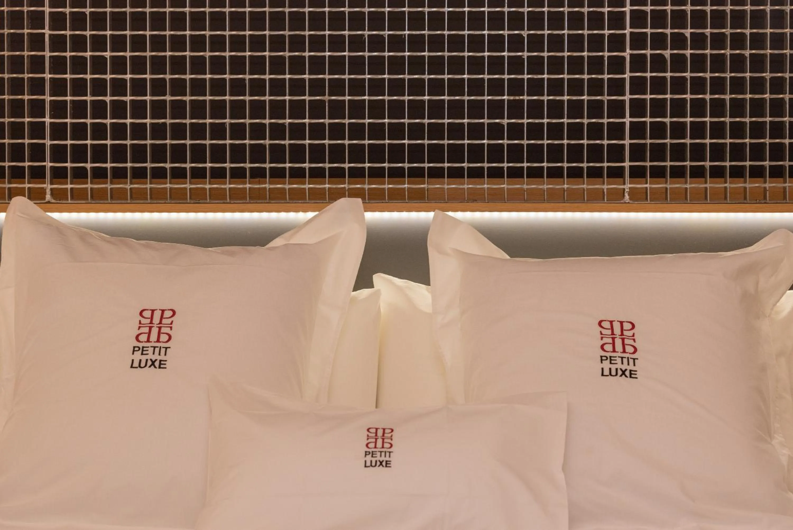 Property logo or sign, Bed in Petit Luxe Loft