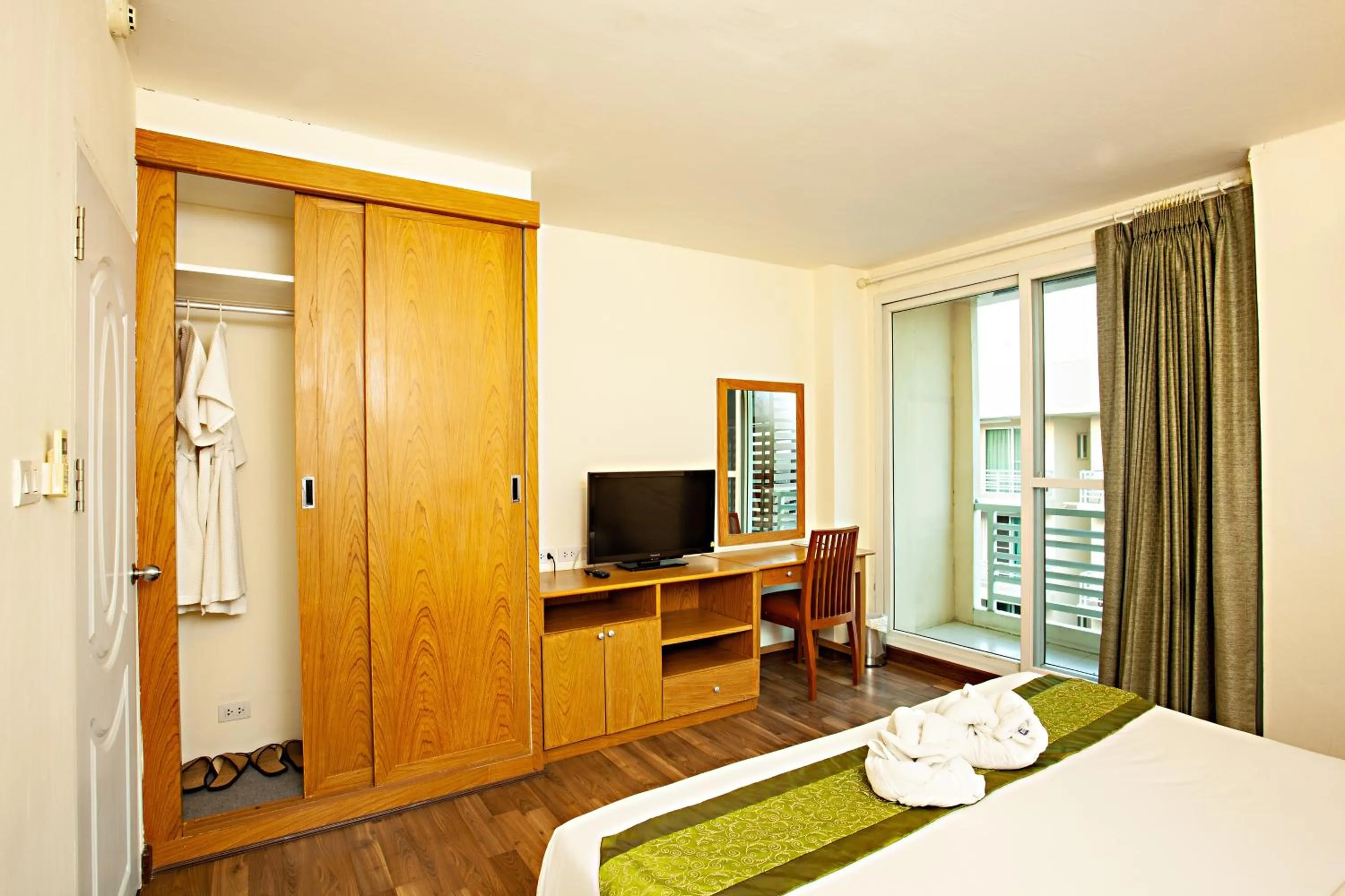 Bed in TM Land Hotel