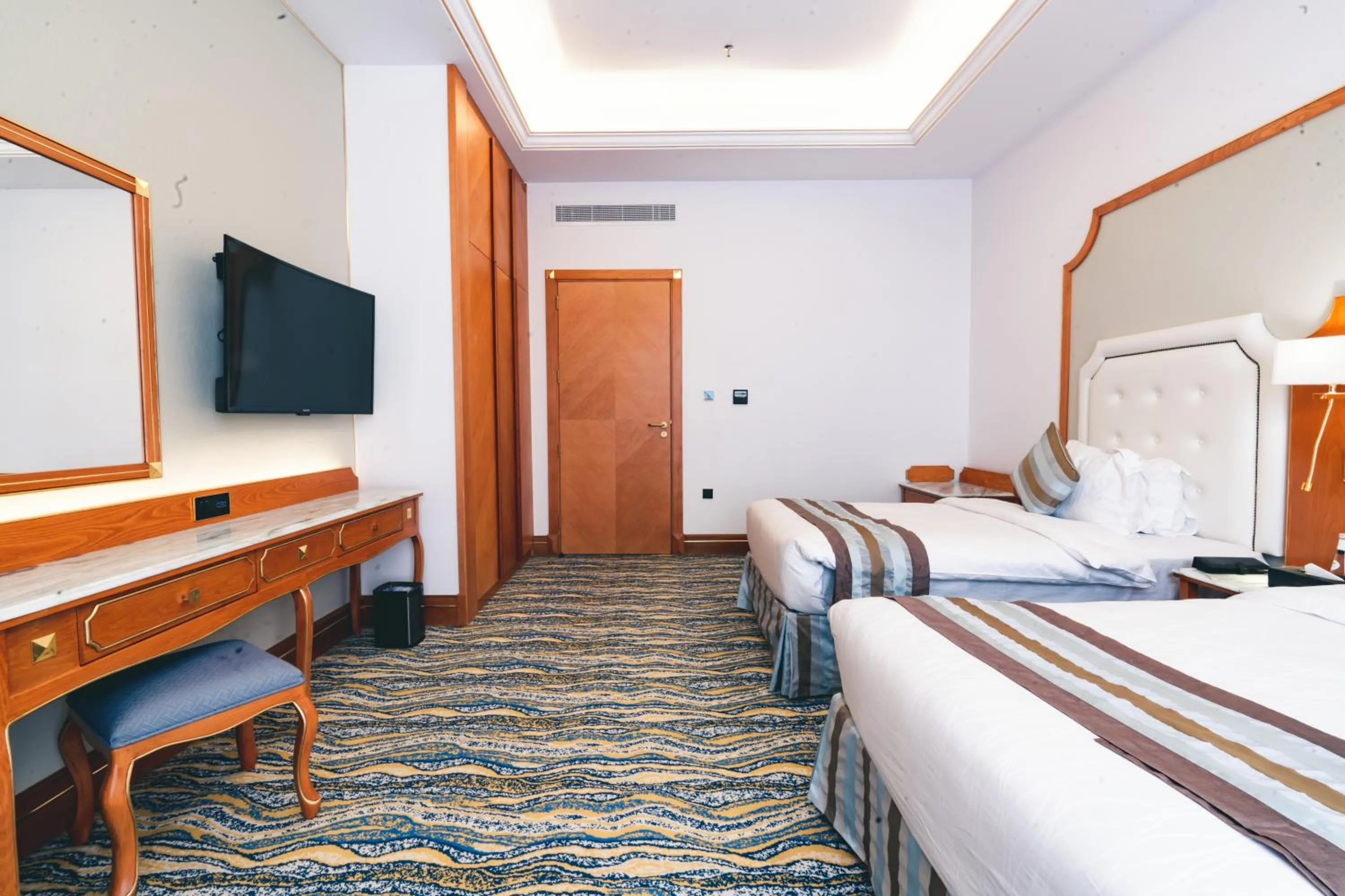 Bed in Iridium Hotel