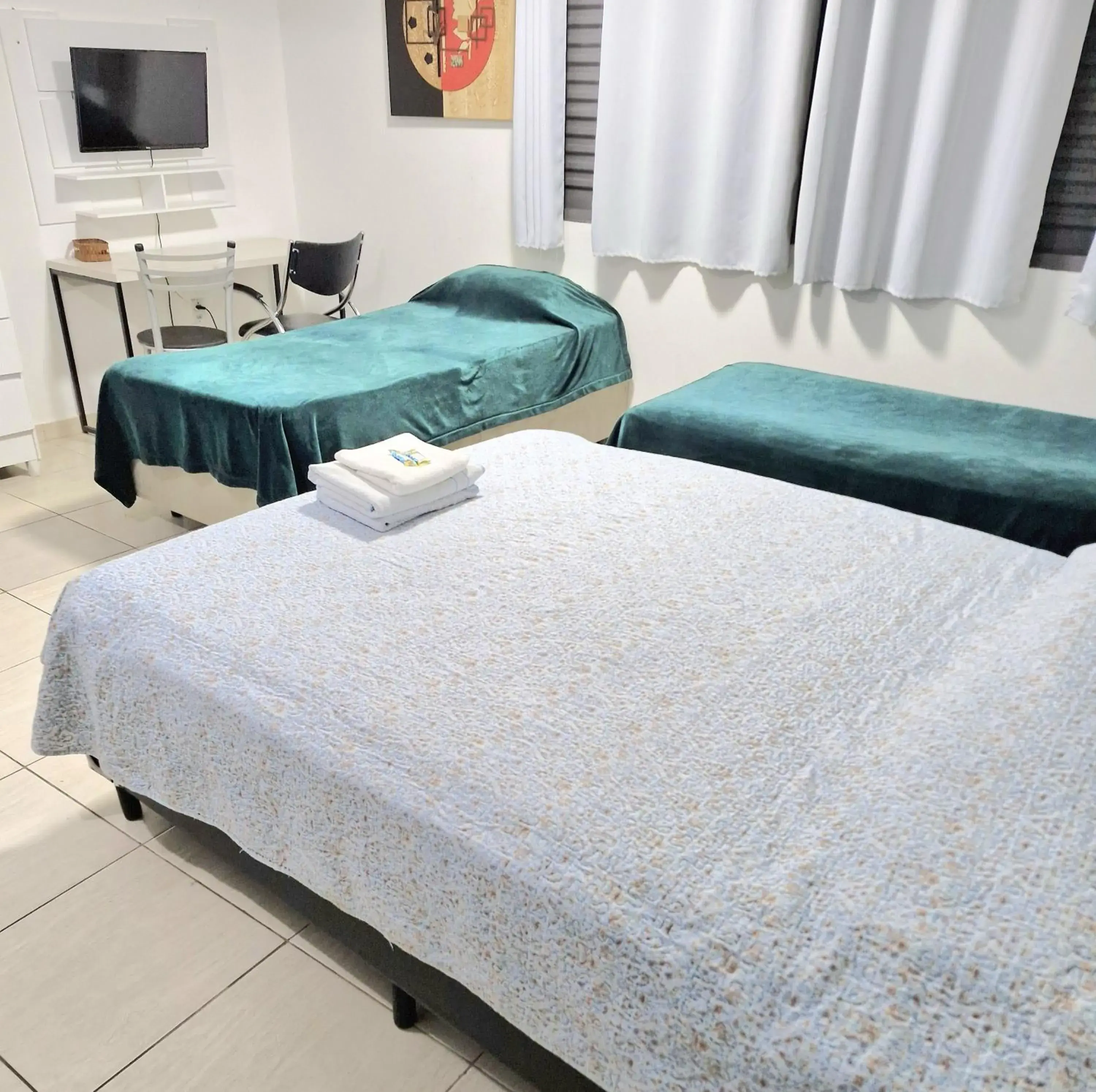 Classic Triple Room - single occupancy in Acqua Flats Jaguariúna Classic Triple Room - single occupancy in Acqua Flats Jaguariúna