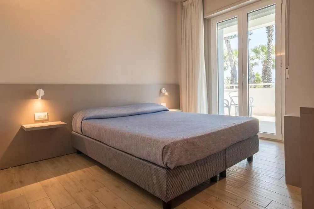 Bed in Family Hotel Relax