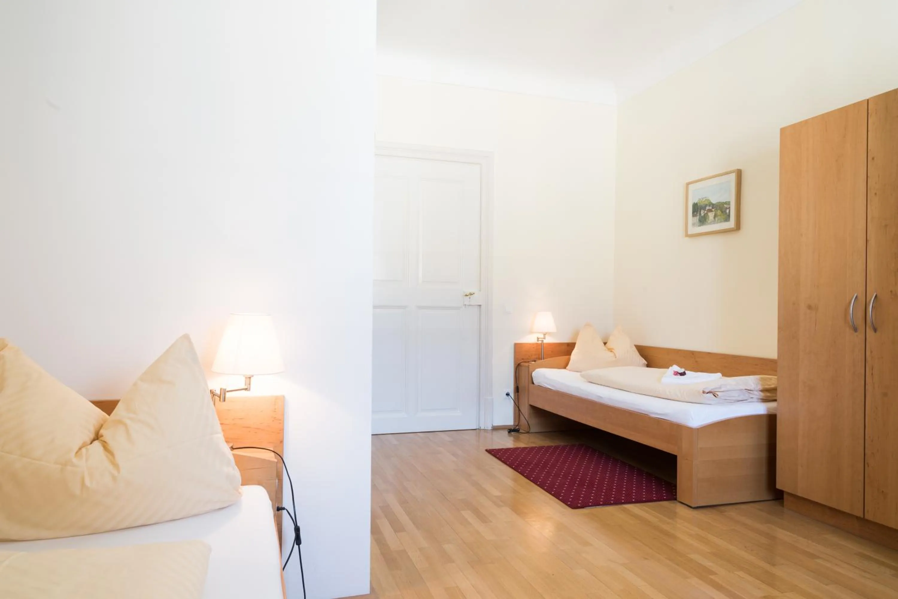 Photo of the whole room, Bed in Gästehaus im Priesterseminar Salzburg