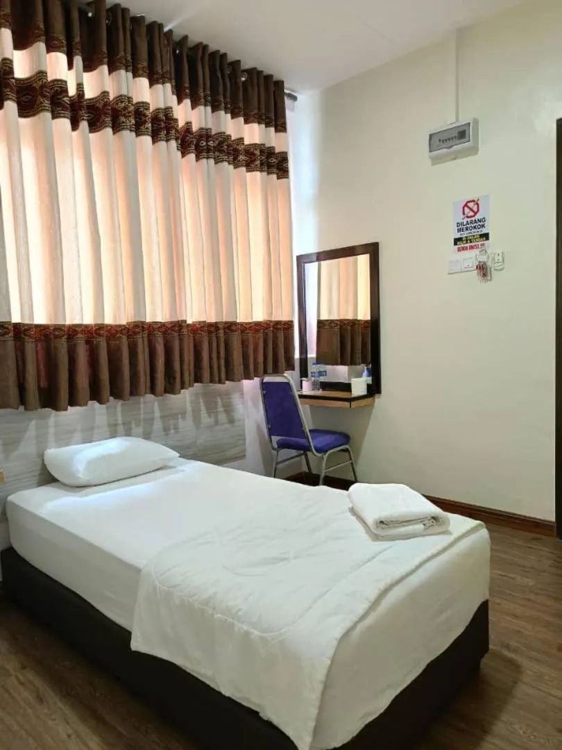 Bed in Hotel Bestari