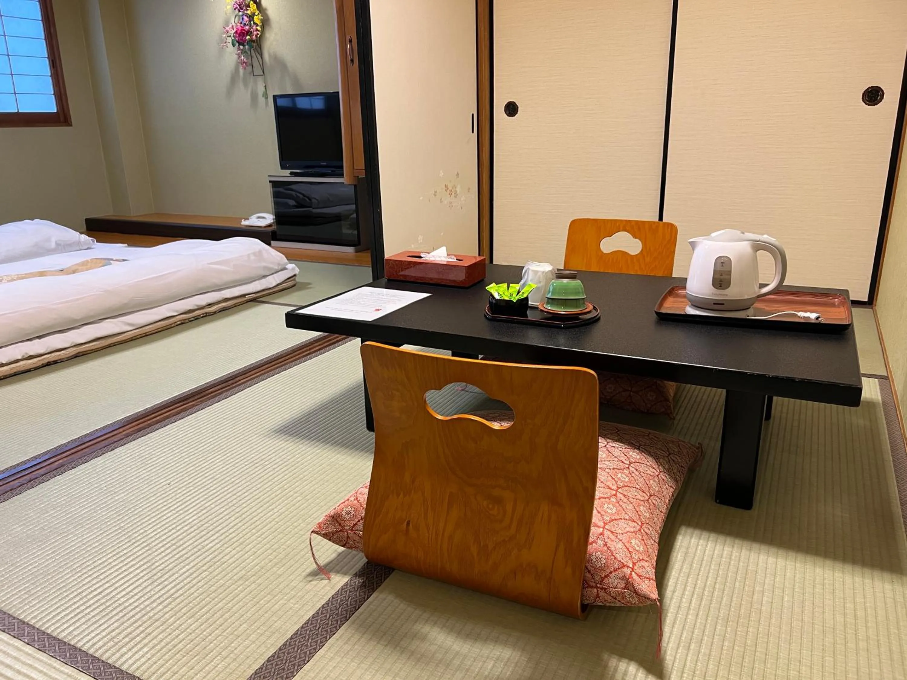 Seating area in Ryokan Kousen Kazeya Group