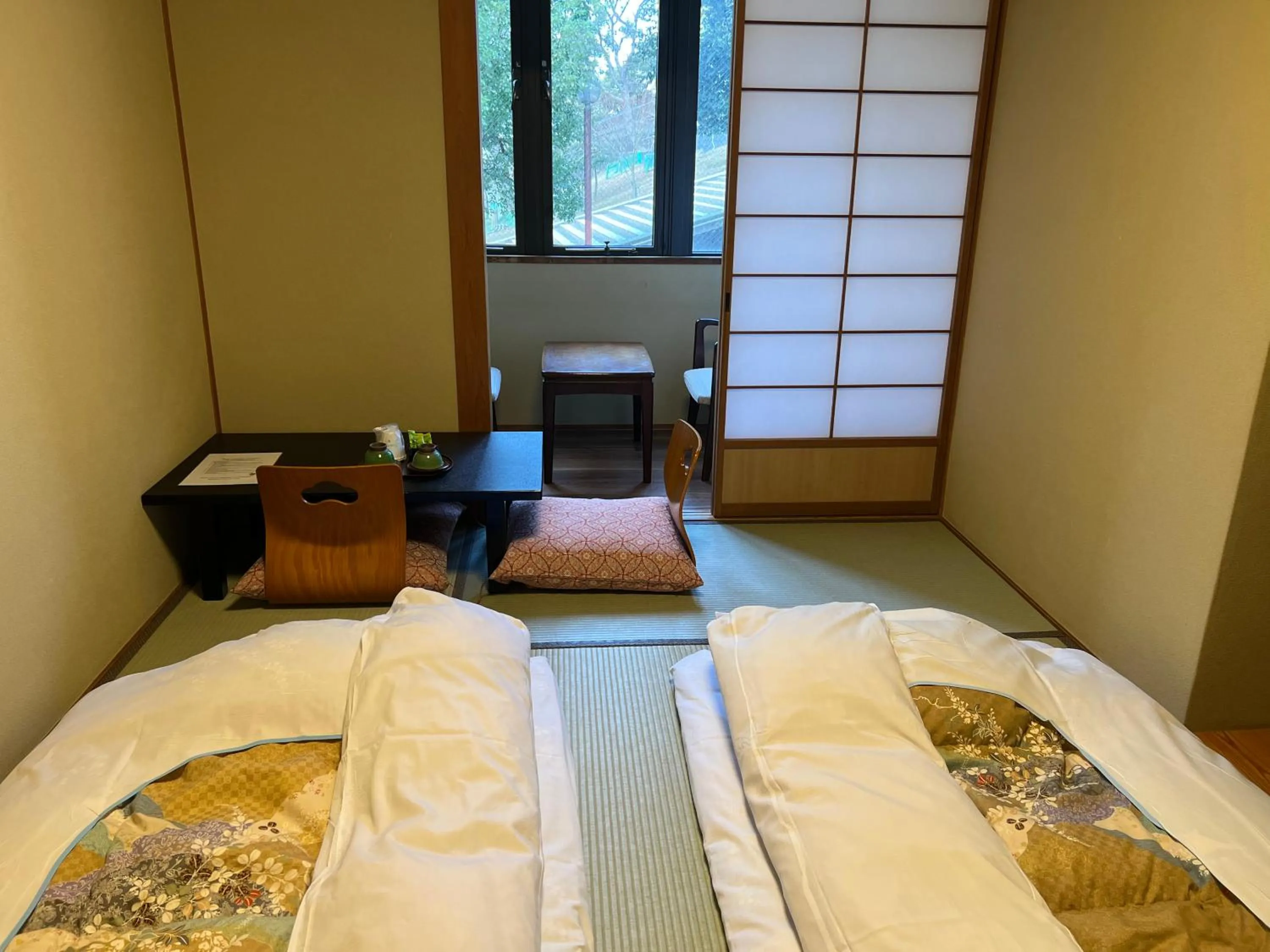 Bed in Ryokan Kousen Kazeya Group